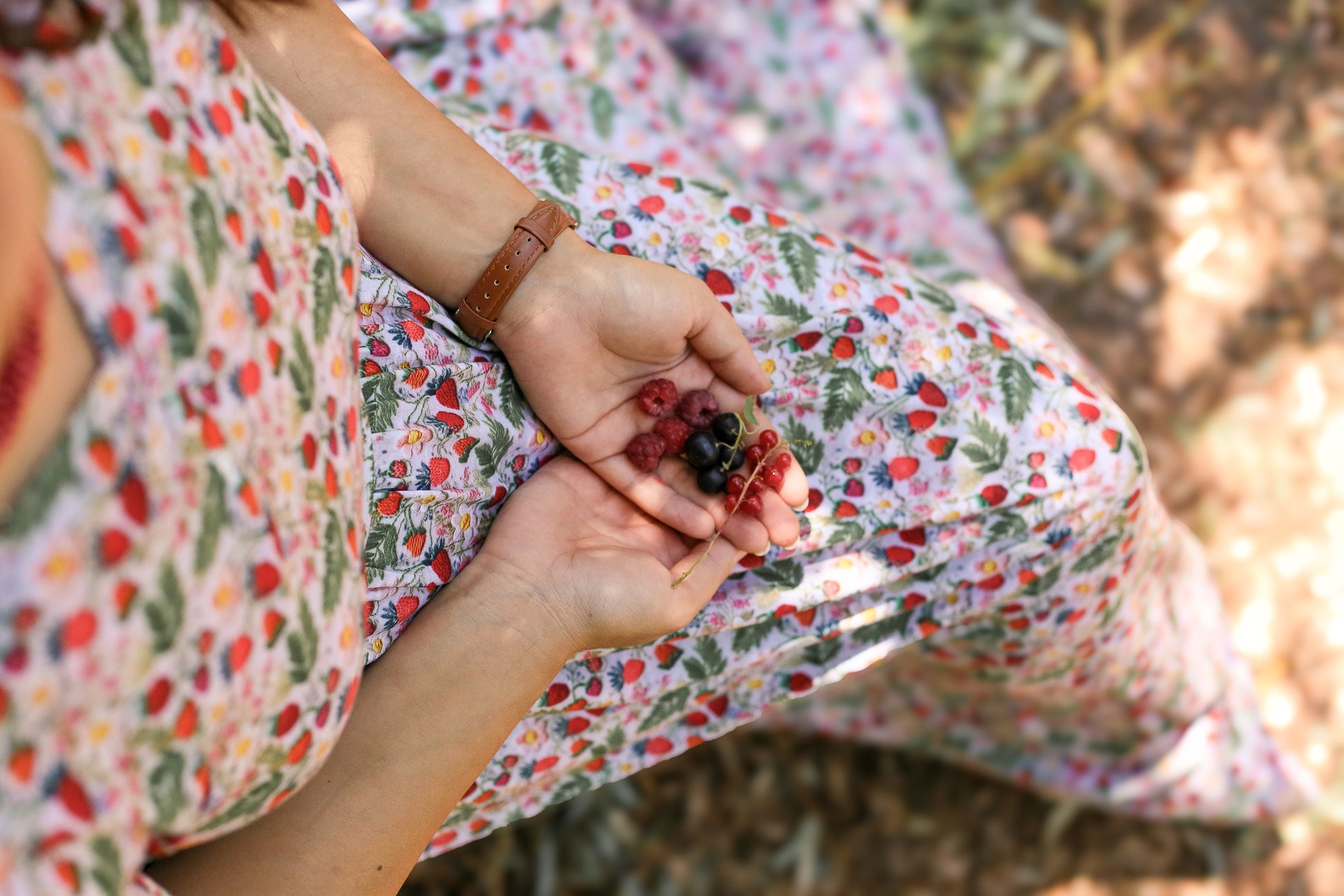Woman in a floral modest nursing dress.