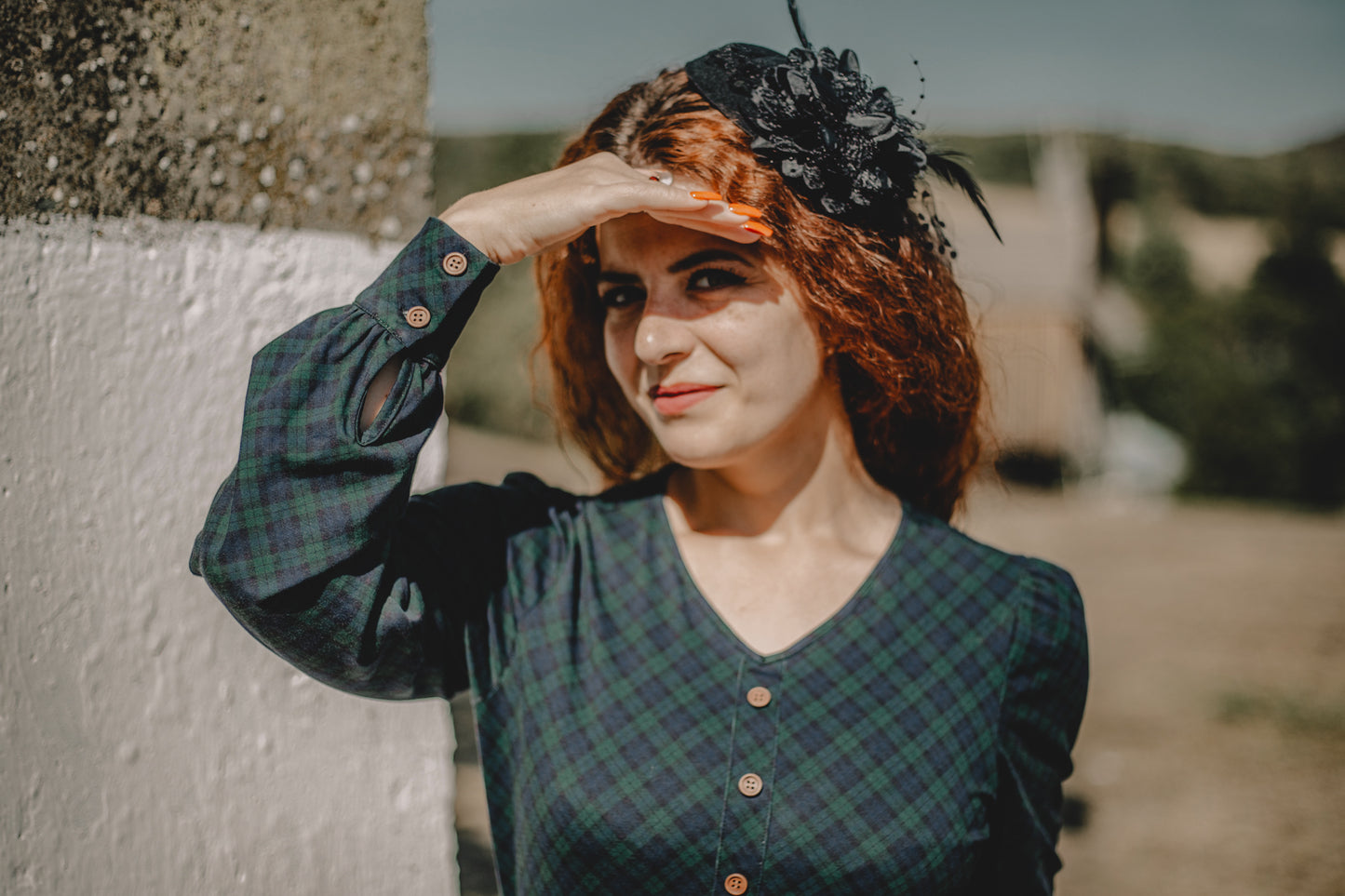 Woman in modest nursing green plaid dress outdoors