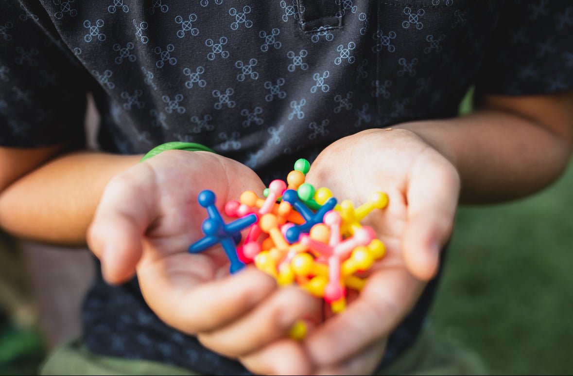 Young boy wearing a dark blue polo shirt