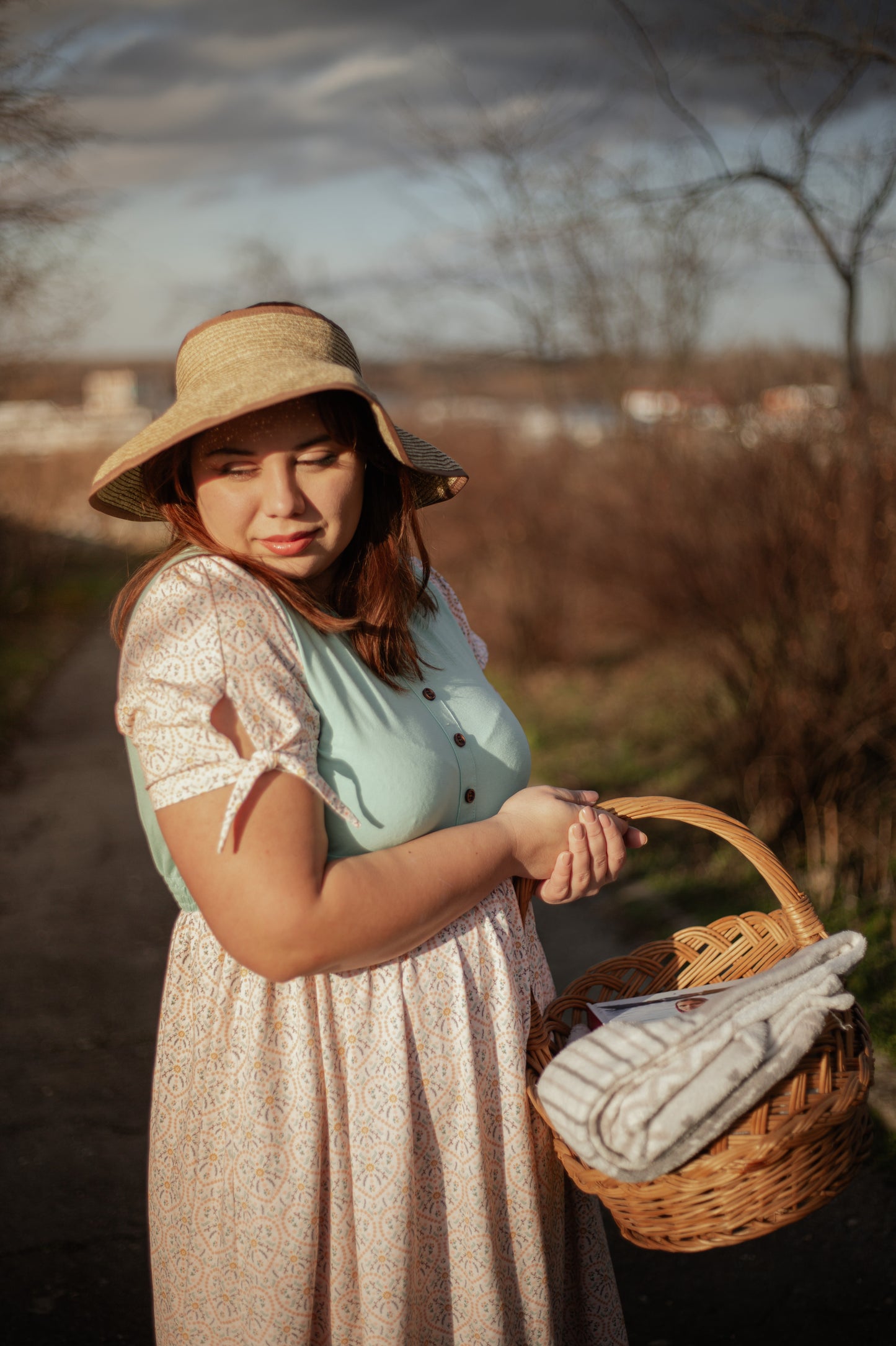 A woman wearing a vintage style modest nursing dress.