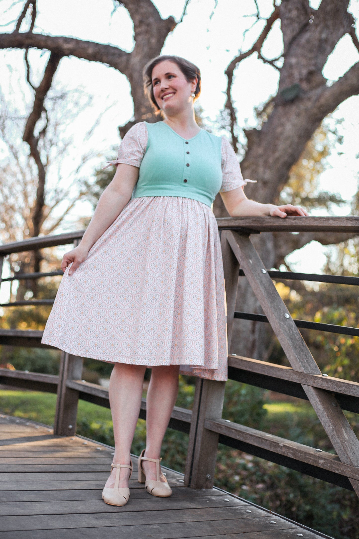 A woman wearing a vintage style modest nursing dress.
