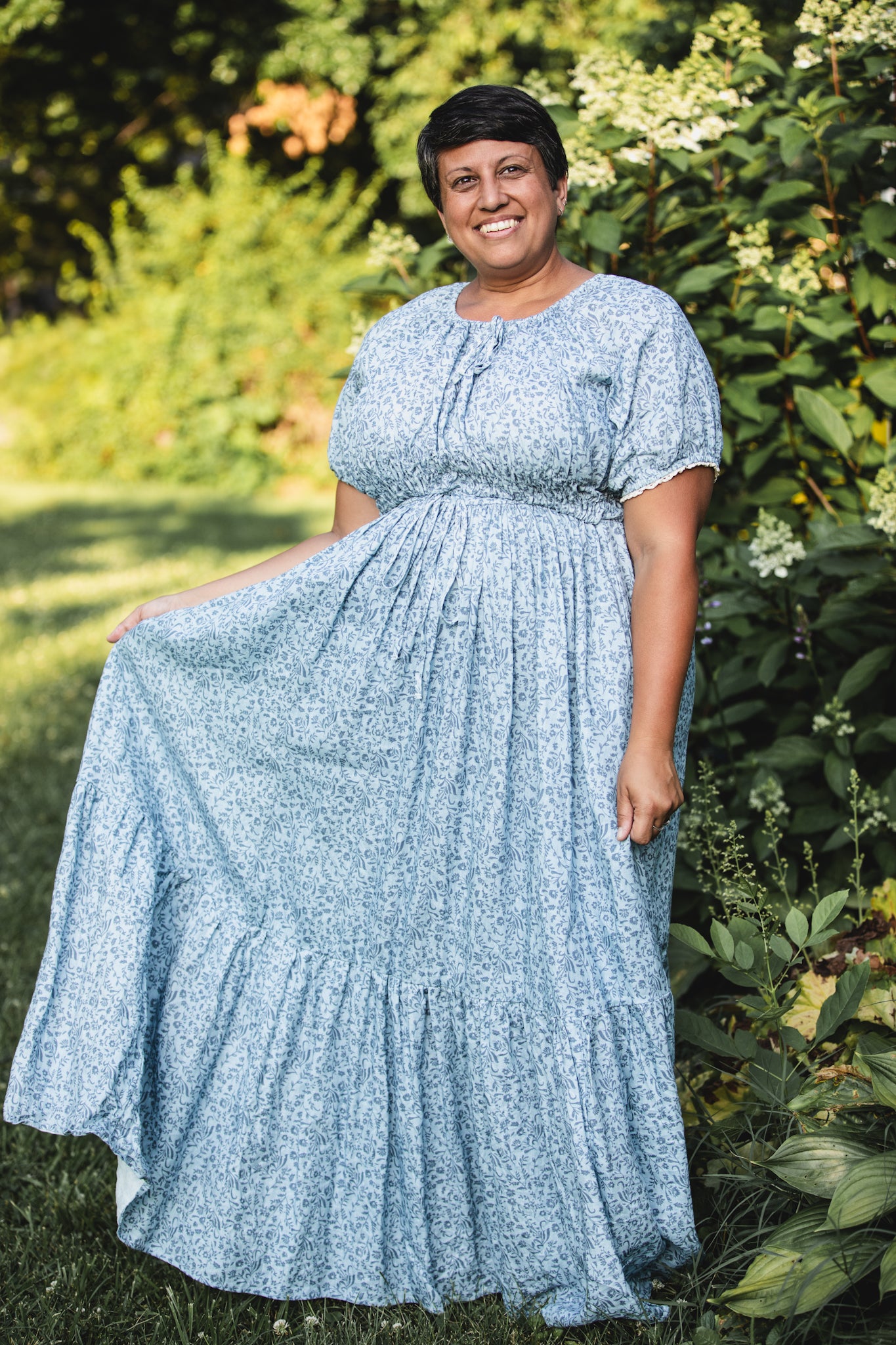 woman in a modest blue nursing dress