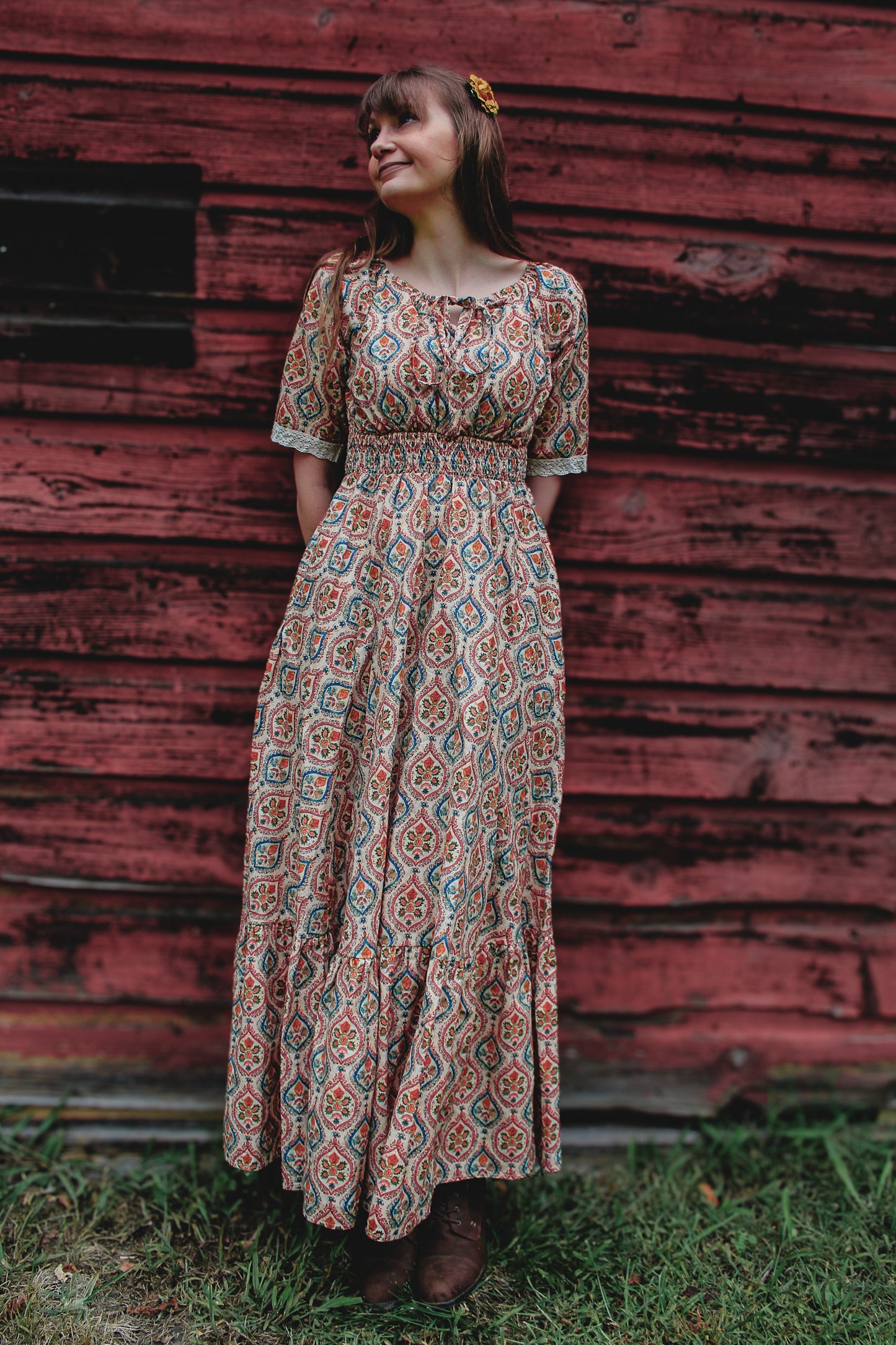 Woman wearing a patterned modest nursing dress