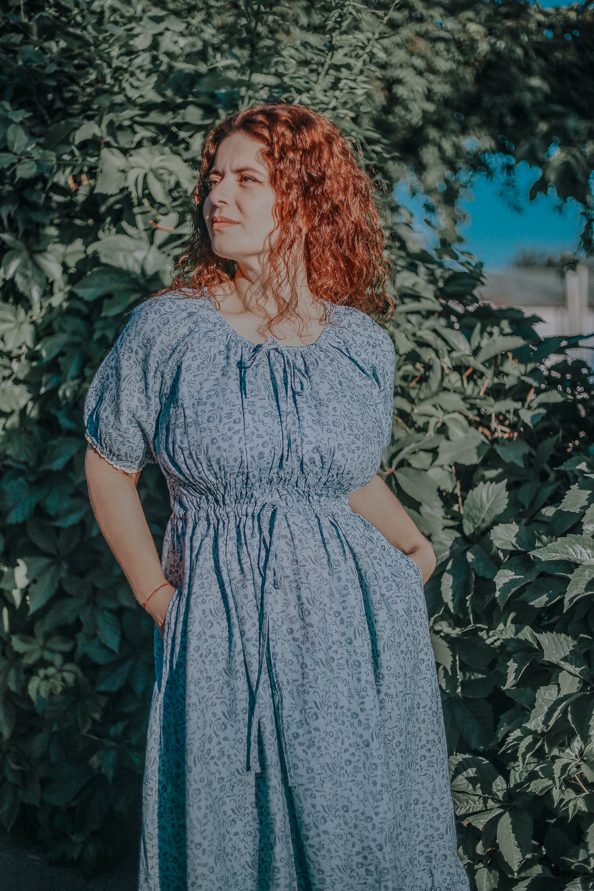 woman in a modest blue nursing dress