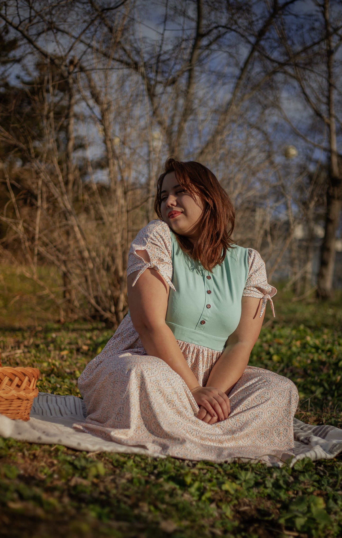 A woman wearing a vintage style modest nursing dress.
