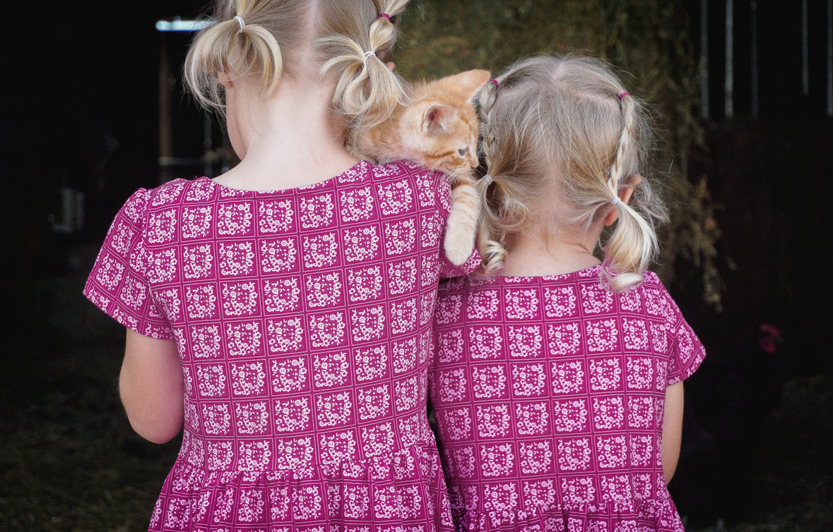 Young girls in modest pink dresses