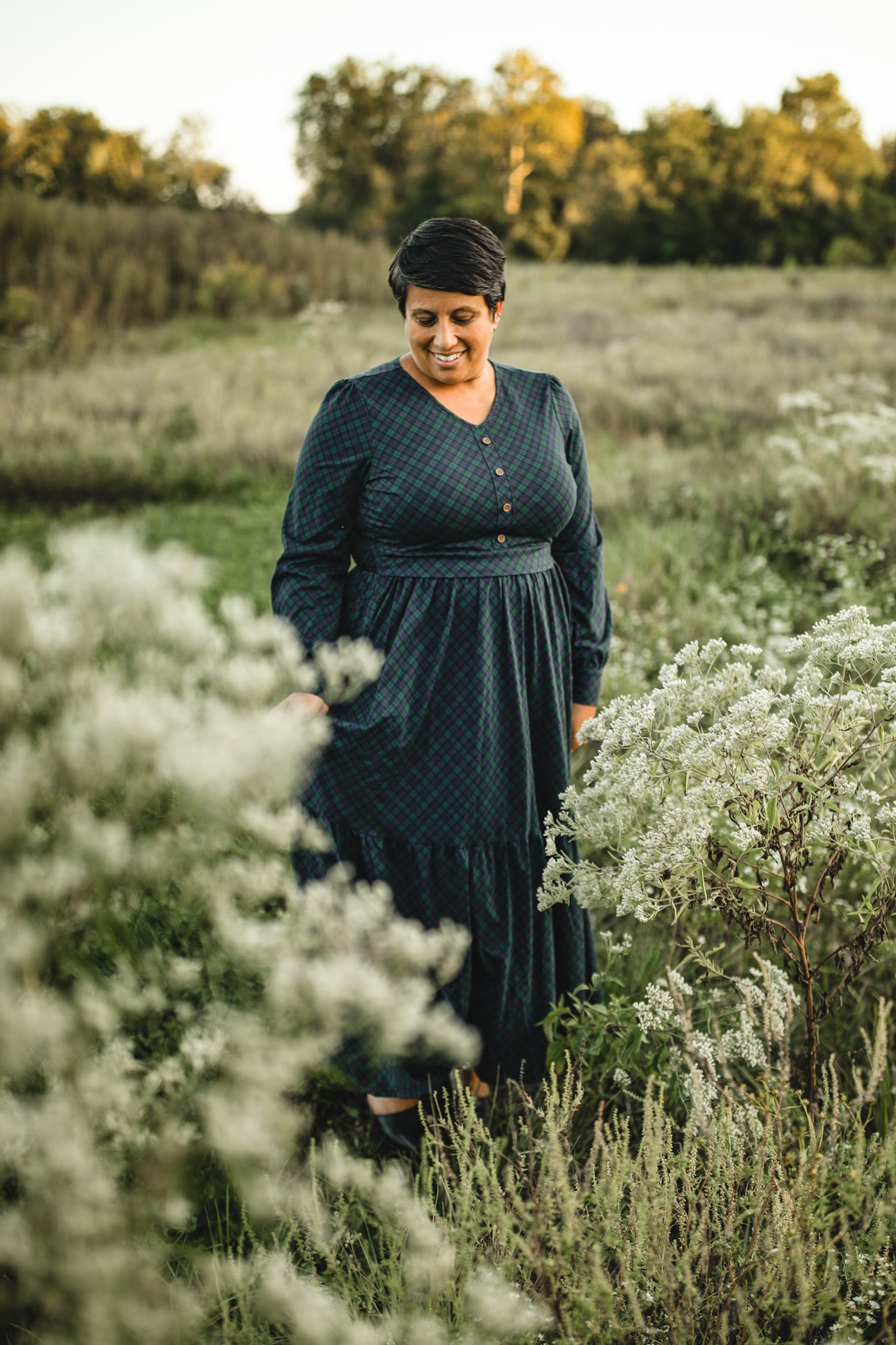 Woman in modest nursing dress white flowers outdoors