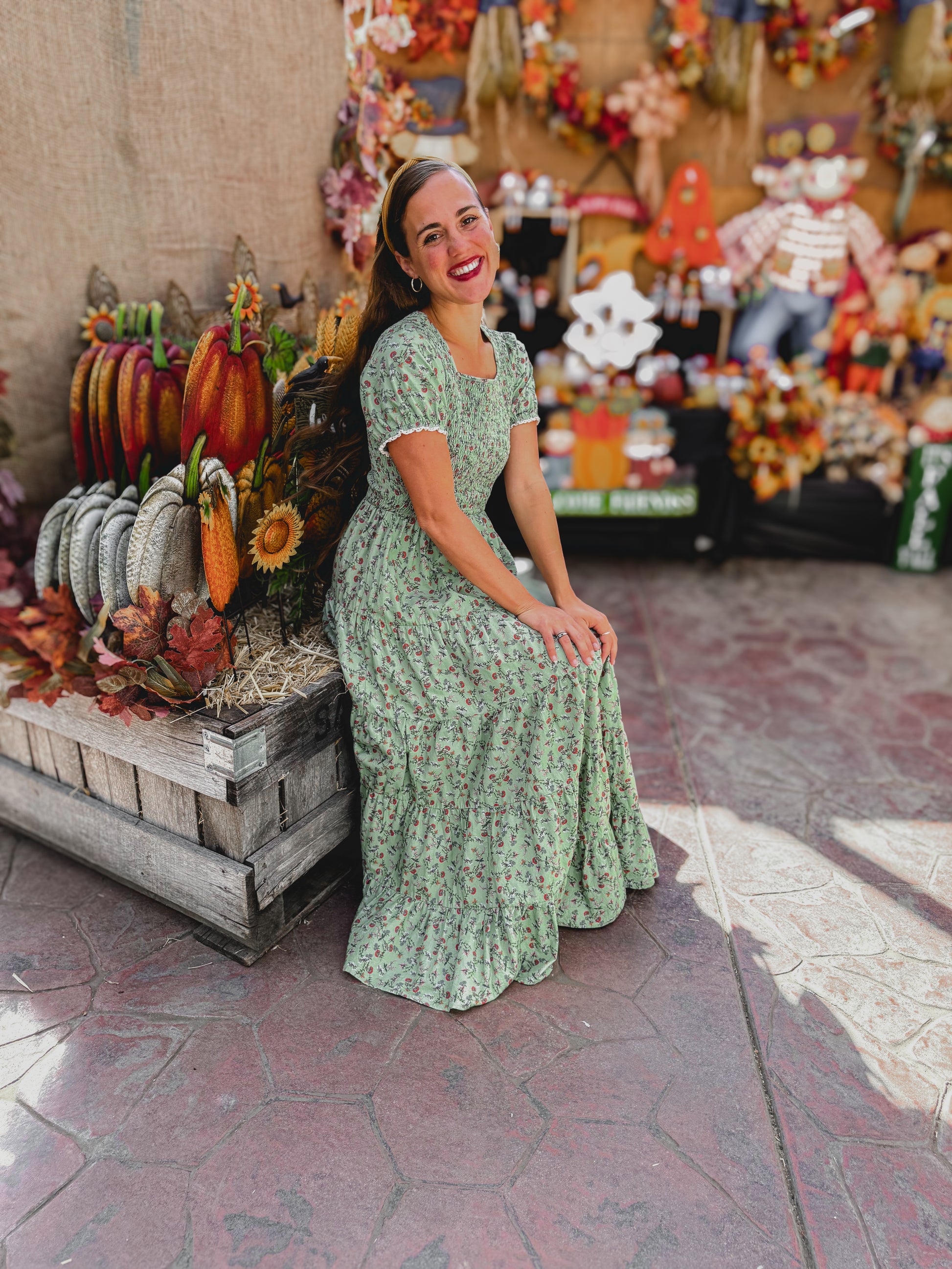 woman wearing a modest nursing green floral dress