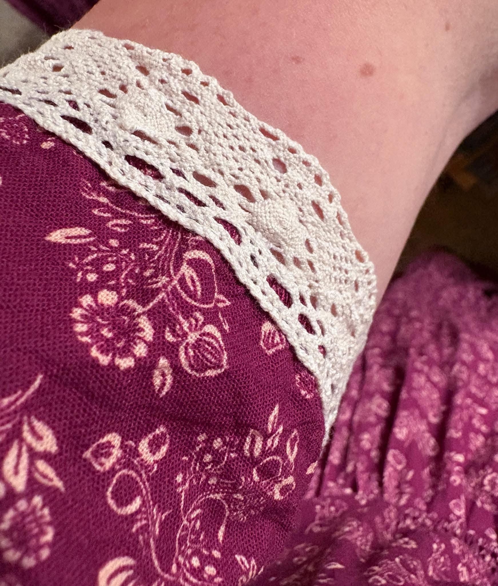Close-up of modest nursing dress with lace trim