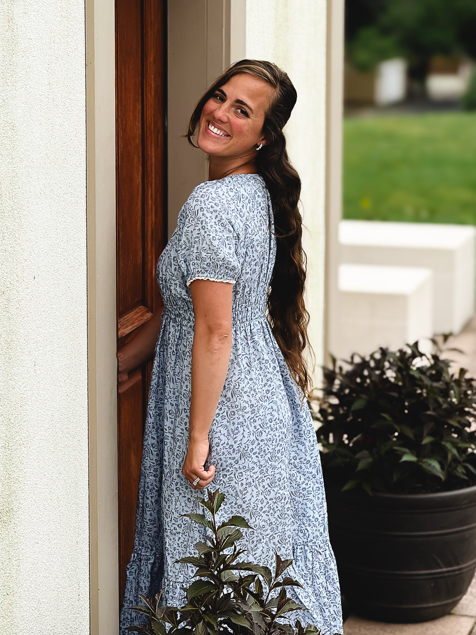 woman in a modest blue nursing dress