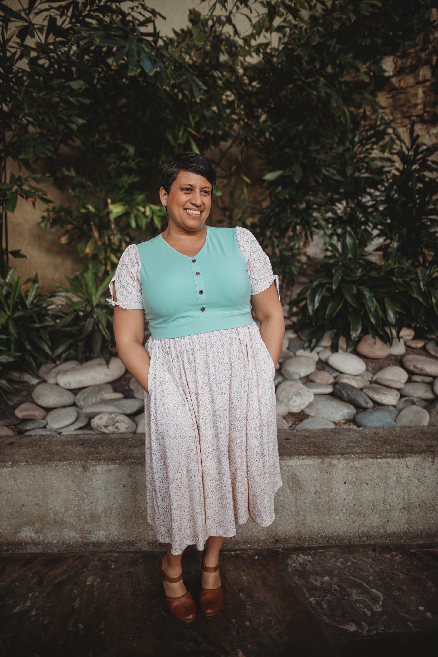 A woman wearing a vintage style modest nursing dress.