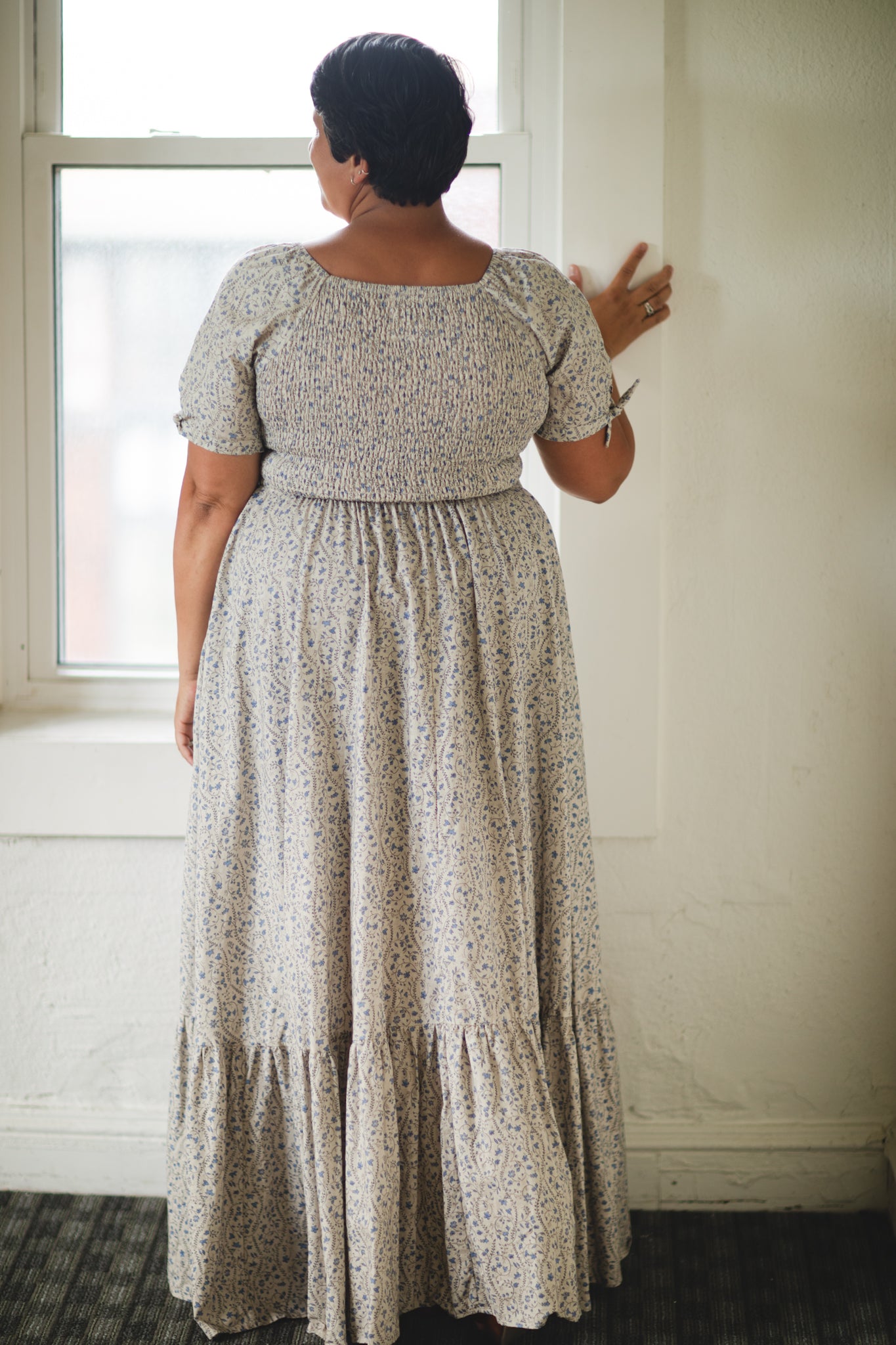 woman in patterned modest nursing dress