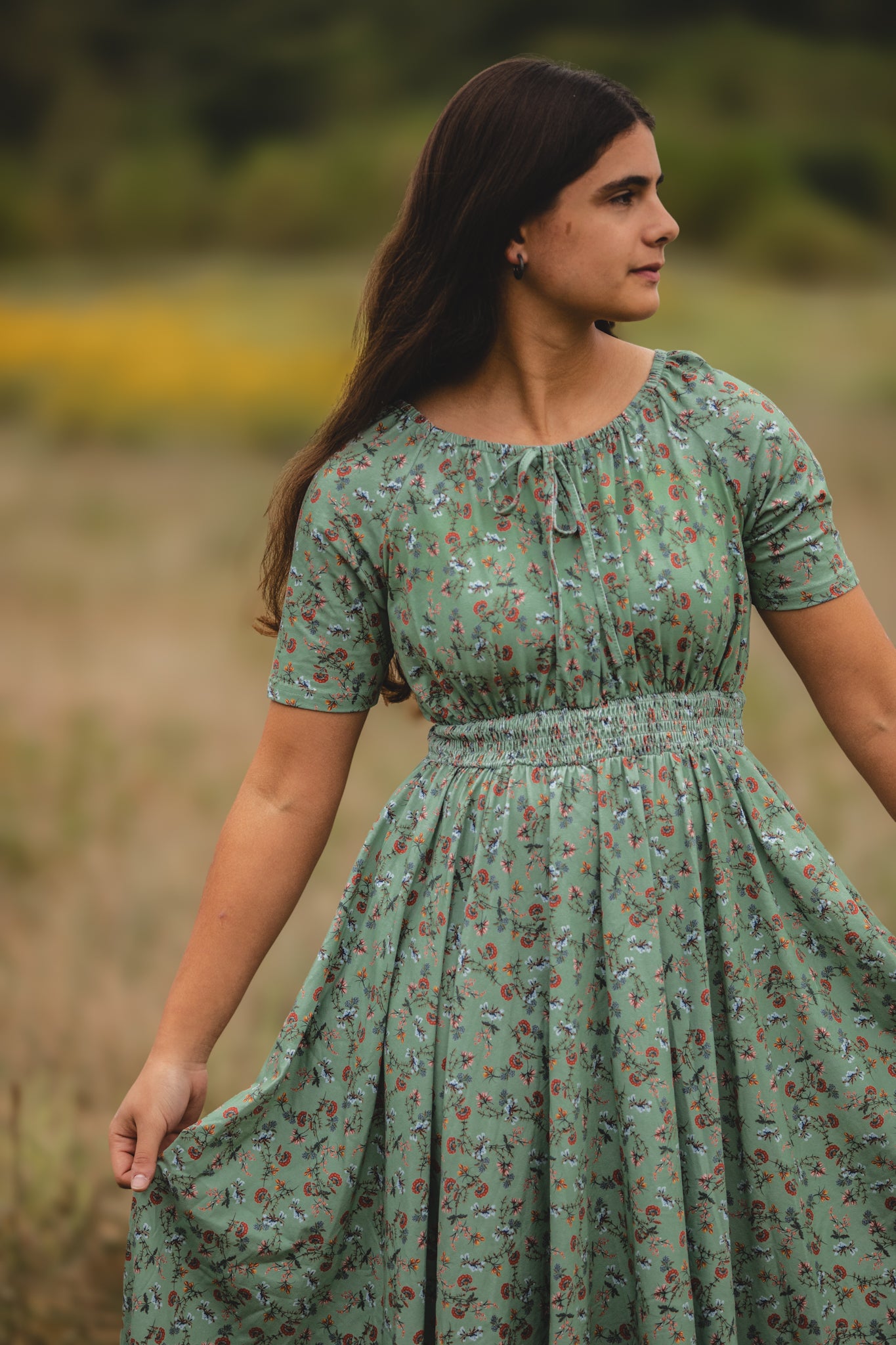 Woman in modest nursing floral dress outdoors