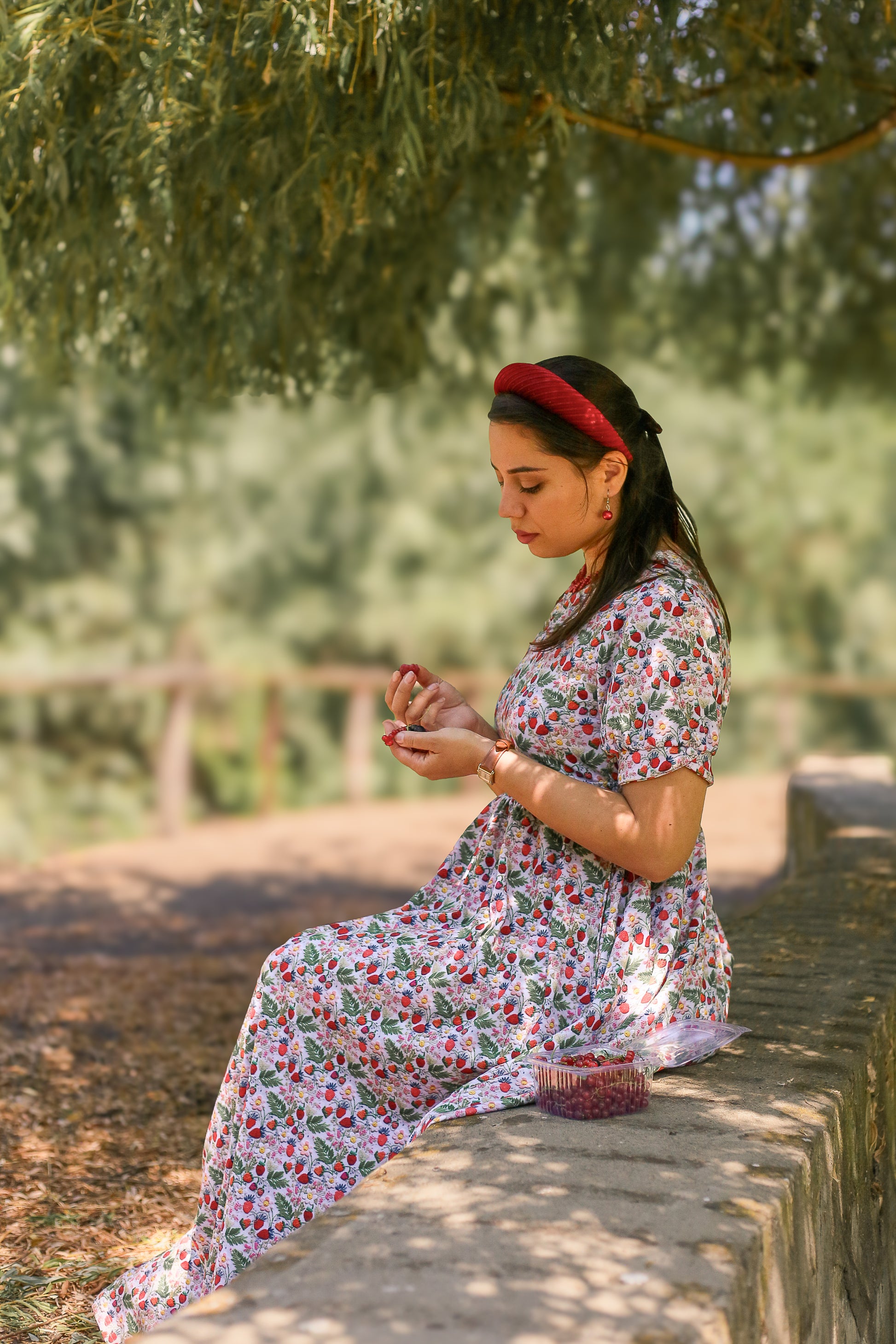 Woman in a floral modest nursing dress