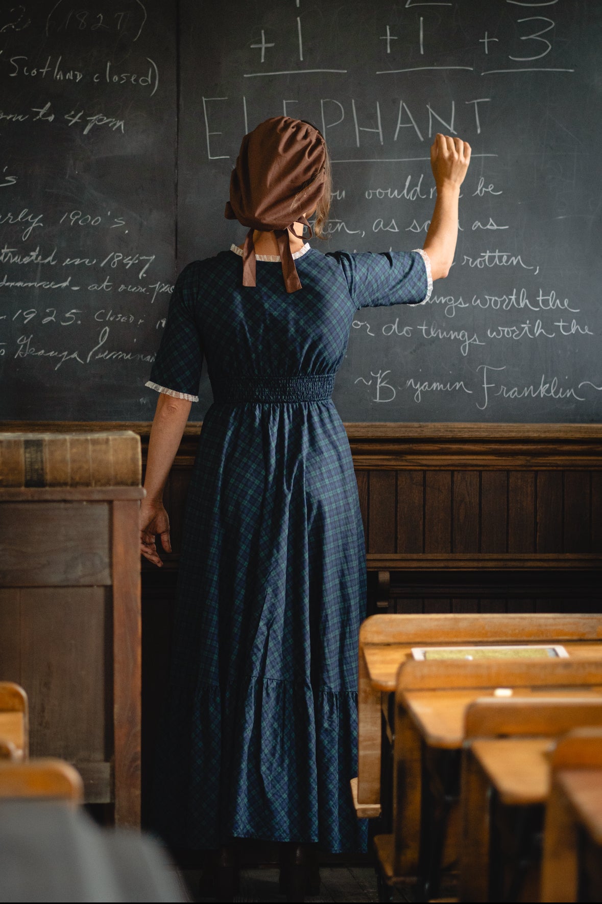 woman wearing a modest nursing blue patterned dress
