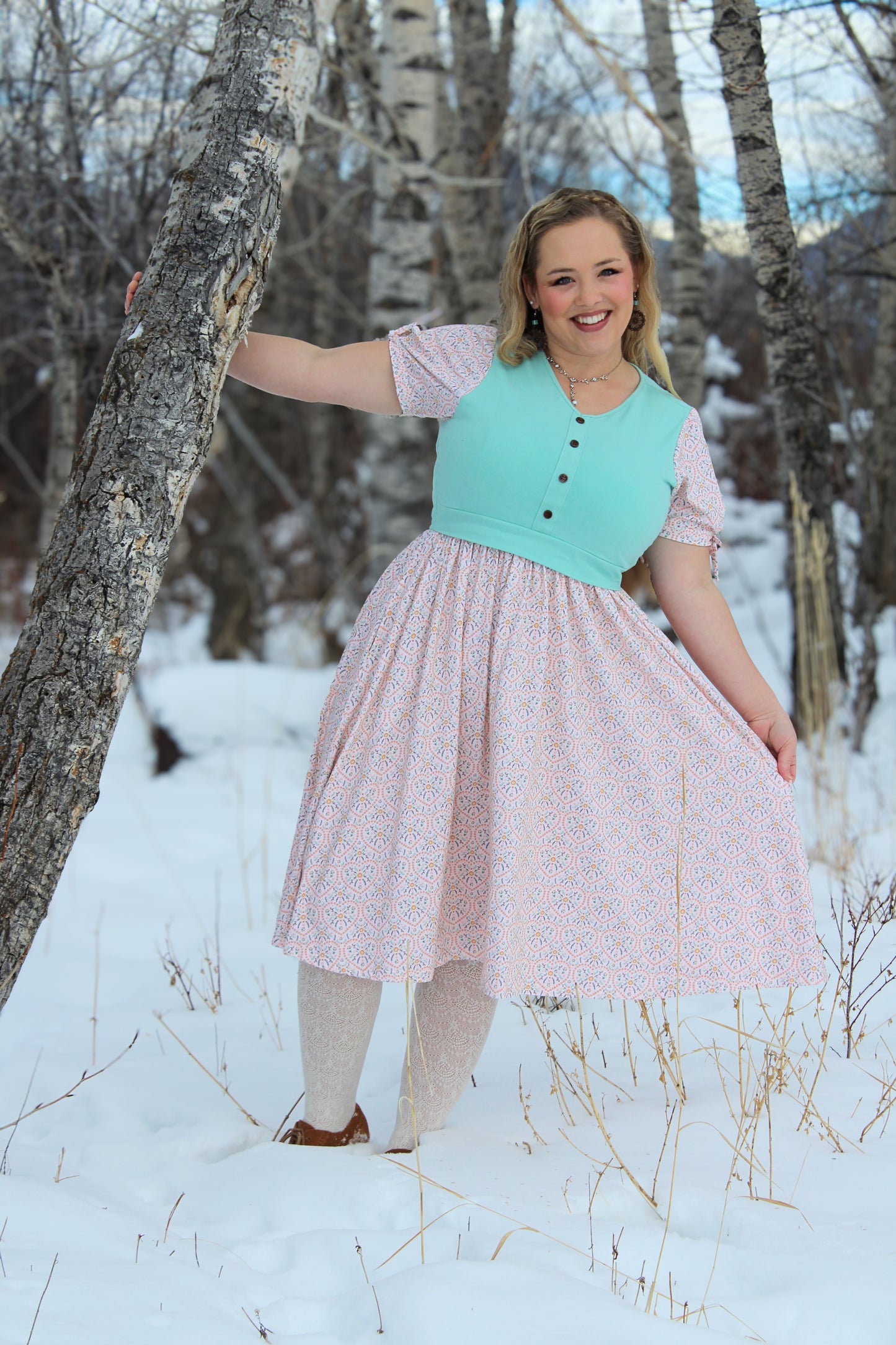 A woman wearing a vintage style modest nursing dress.