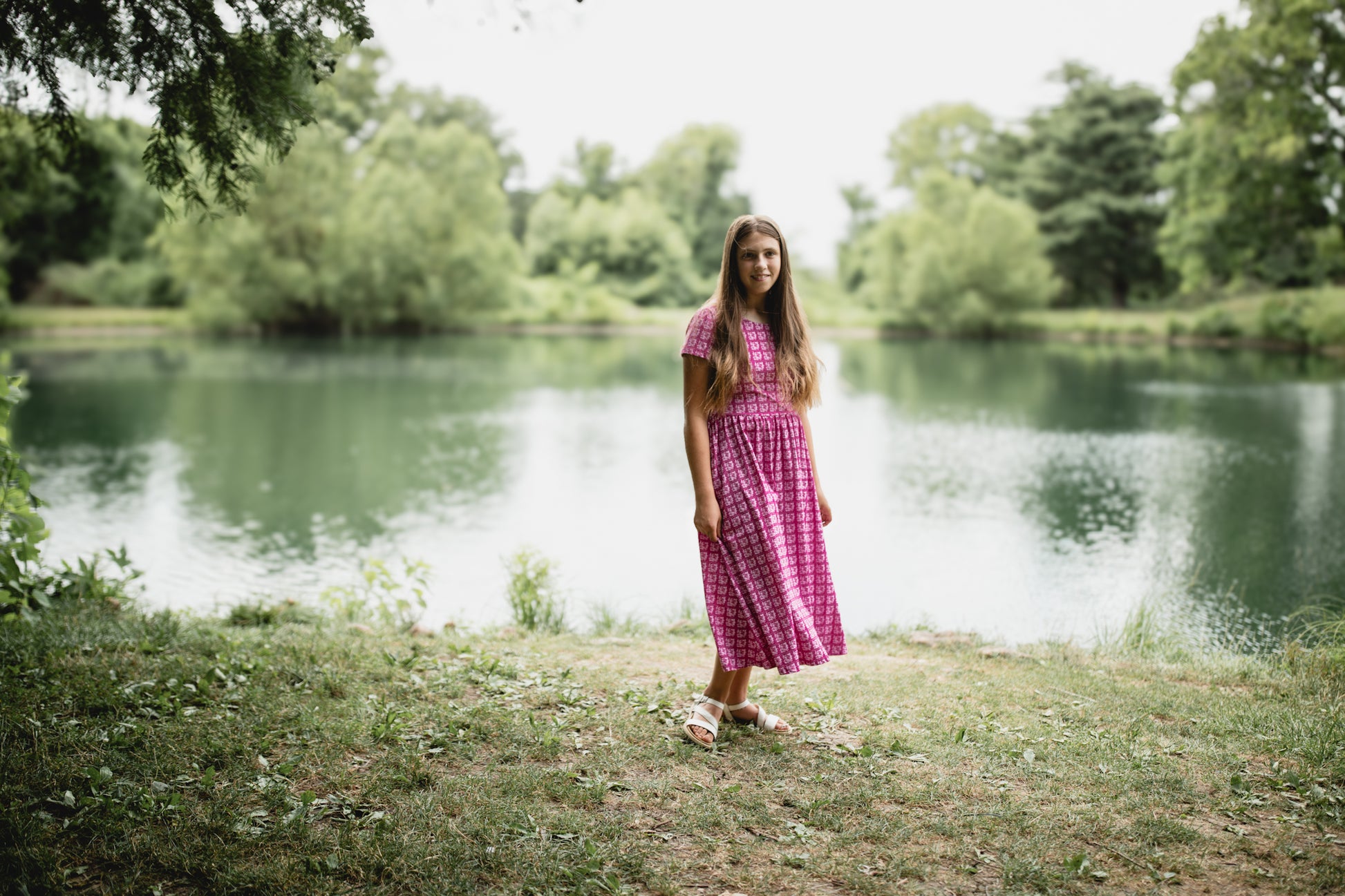 Young girl in a modest pink dress