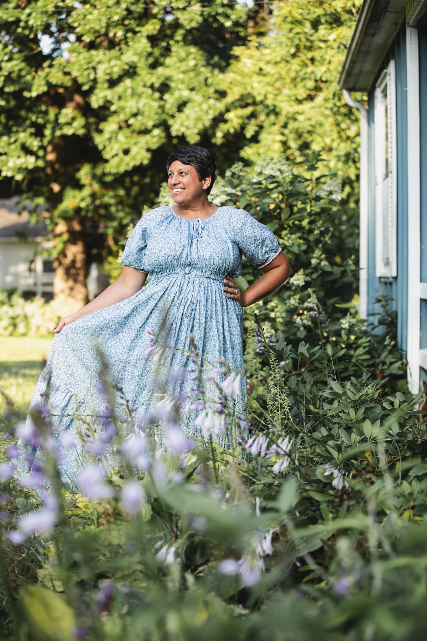 woman in a modest blue nursing dress