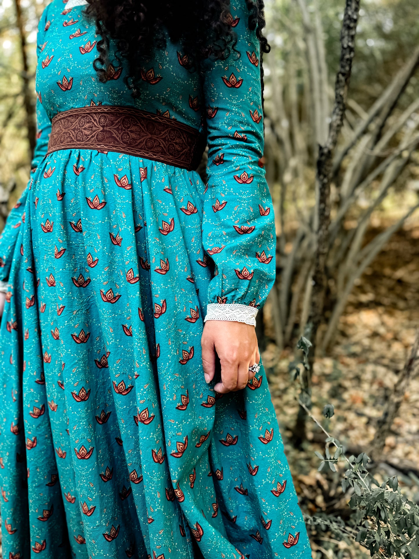 Woman in modest nursing teal dress outdoors