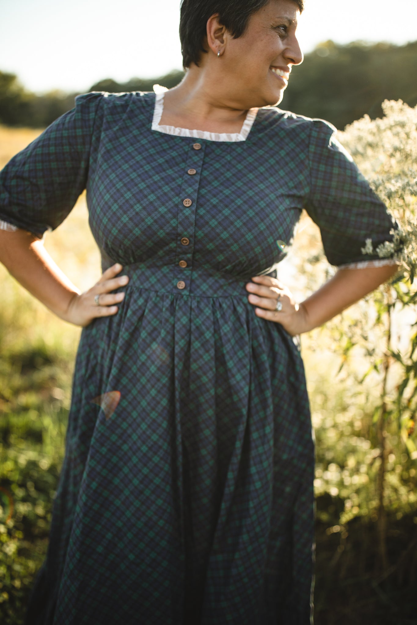 woman wearing a modest nursing blue patterned dress
