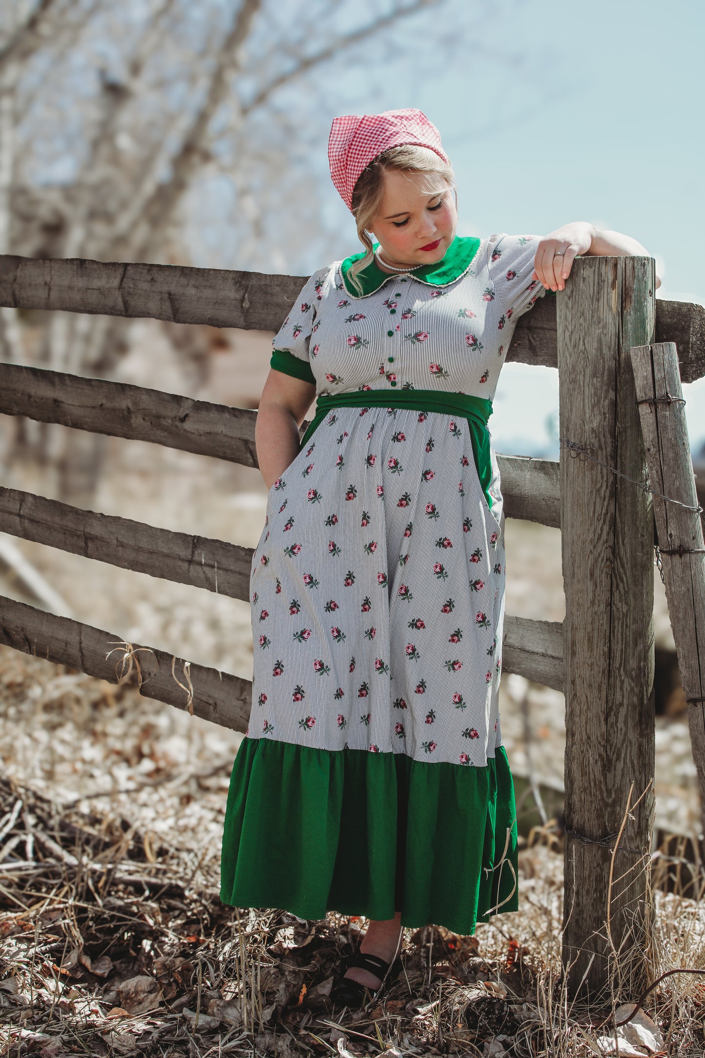 woman wearing a green and white striped modest nursing dress