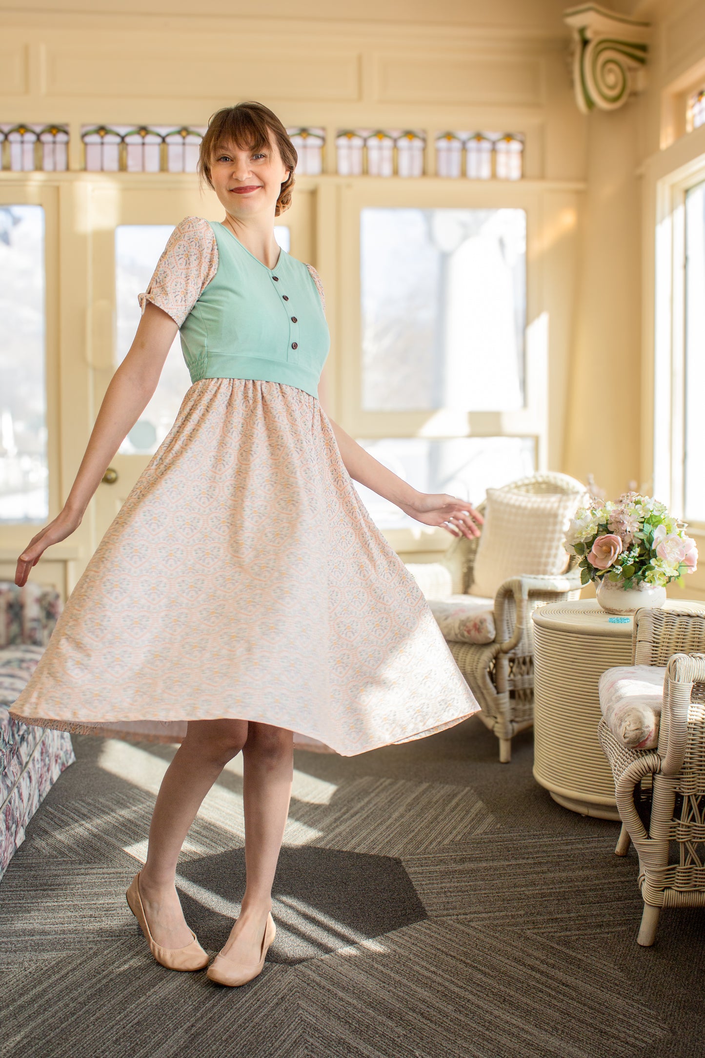 A woman wearing a vintage style modest nursing dress.