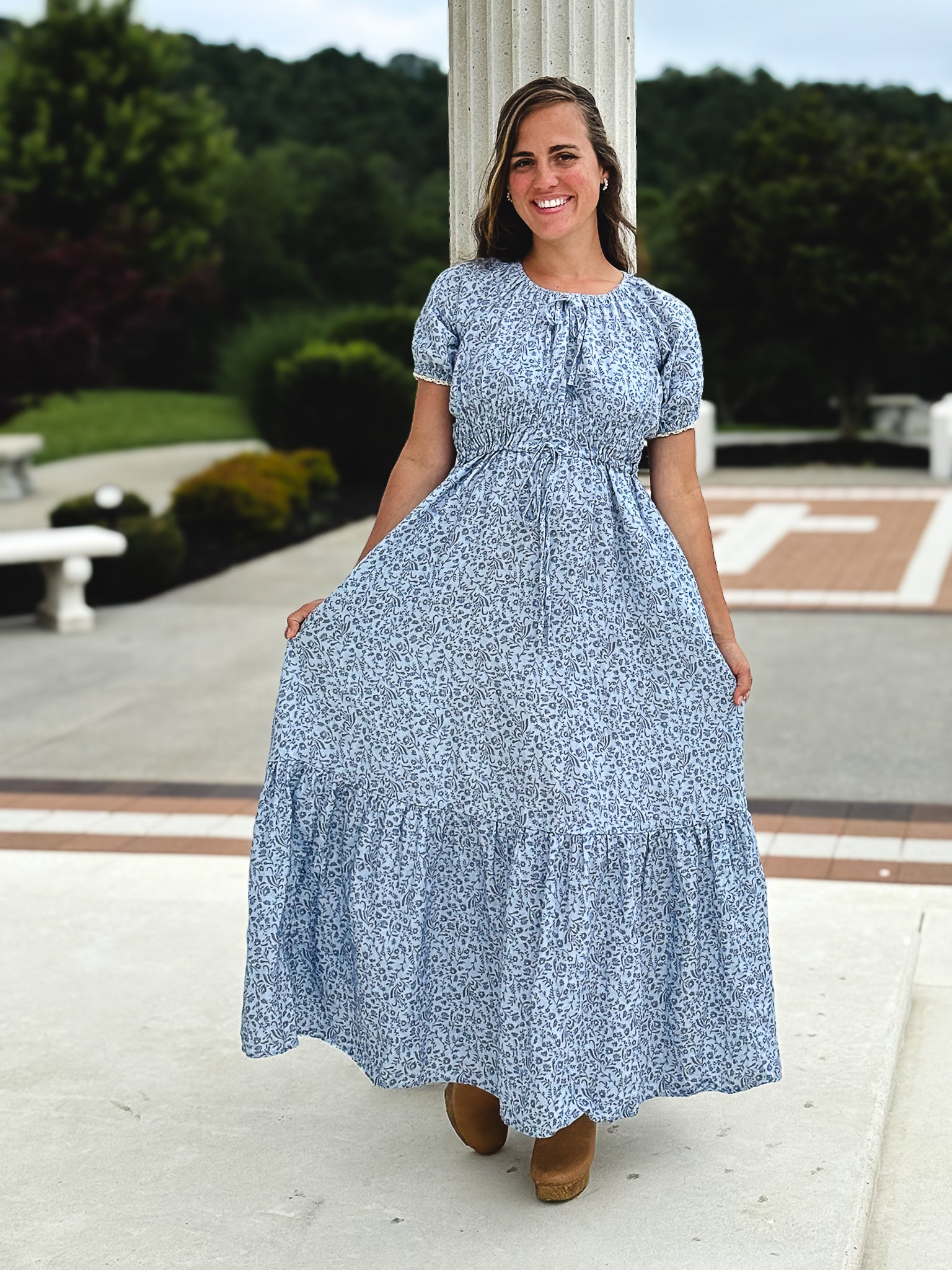 woman in a modest blue nursing dress