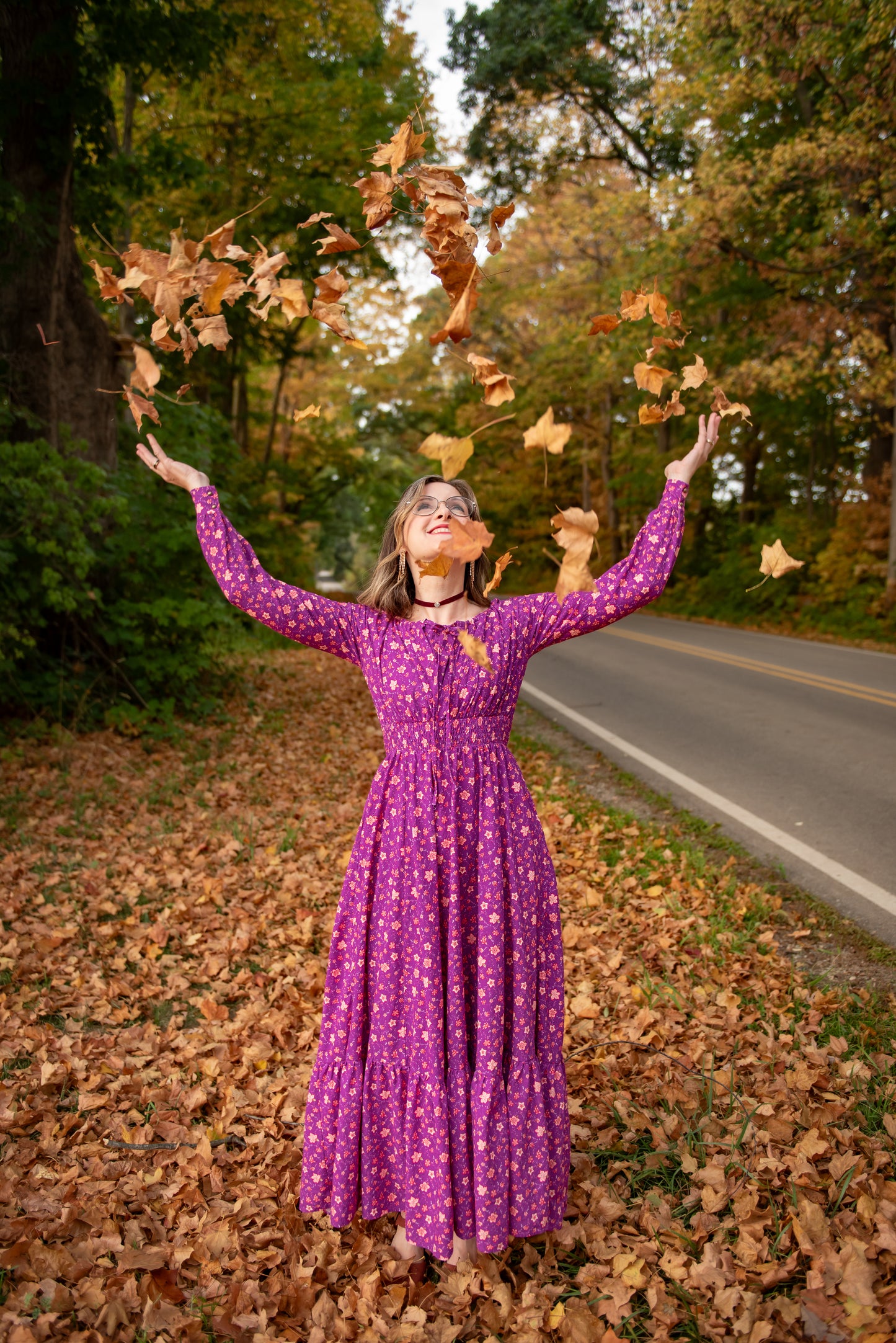 Woman in modest purple nursing dress outdoors