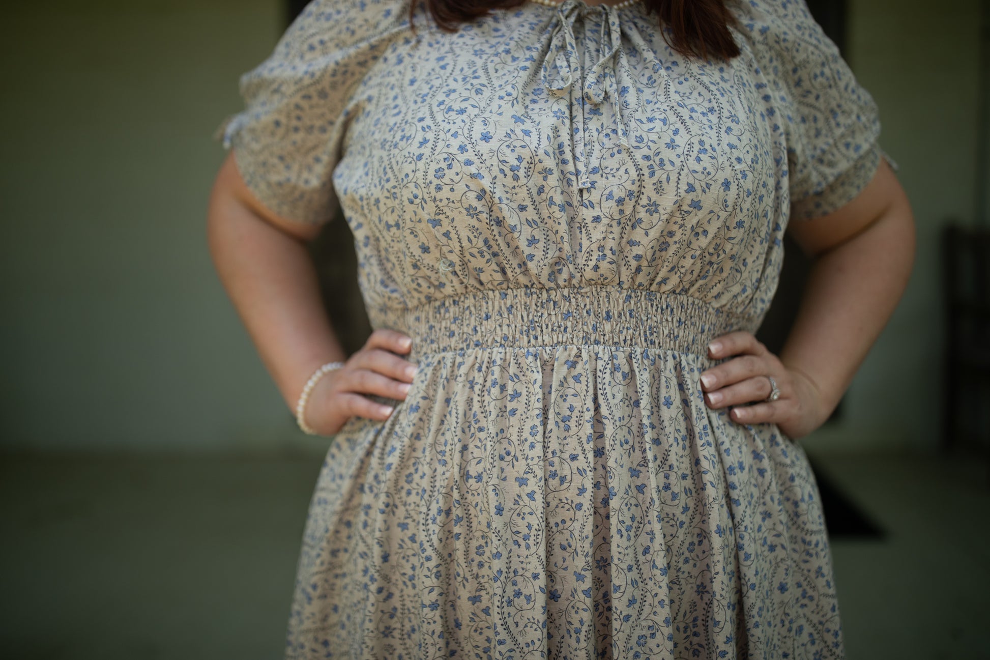 woman in patterned modest nursing dress