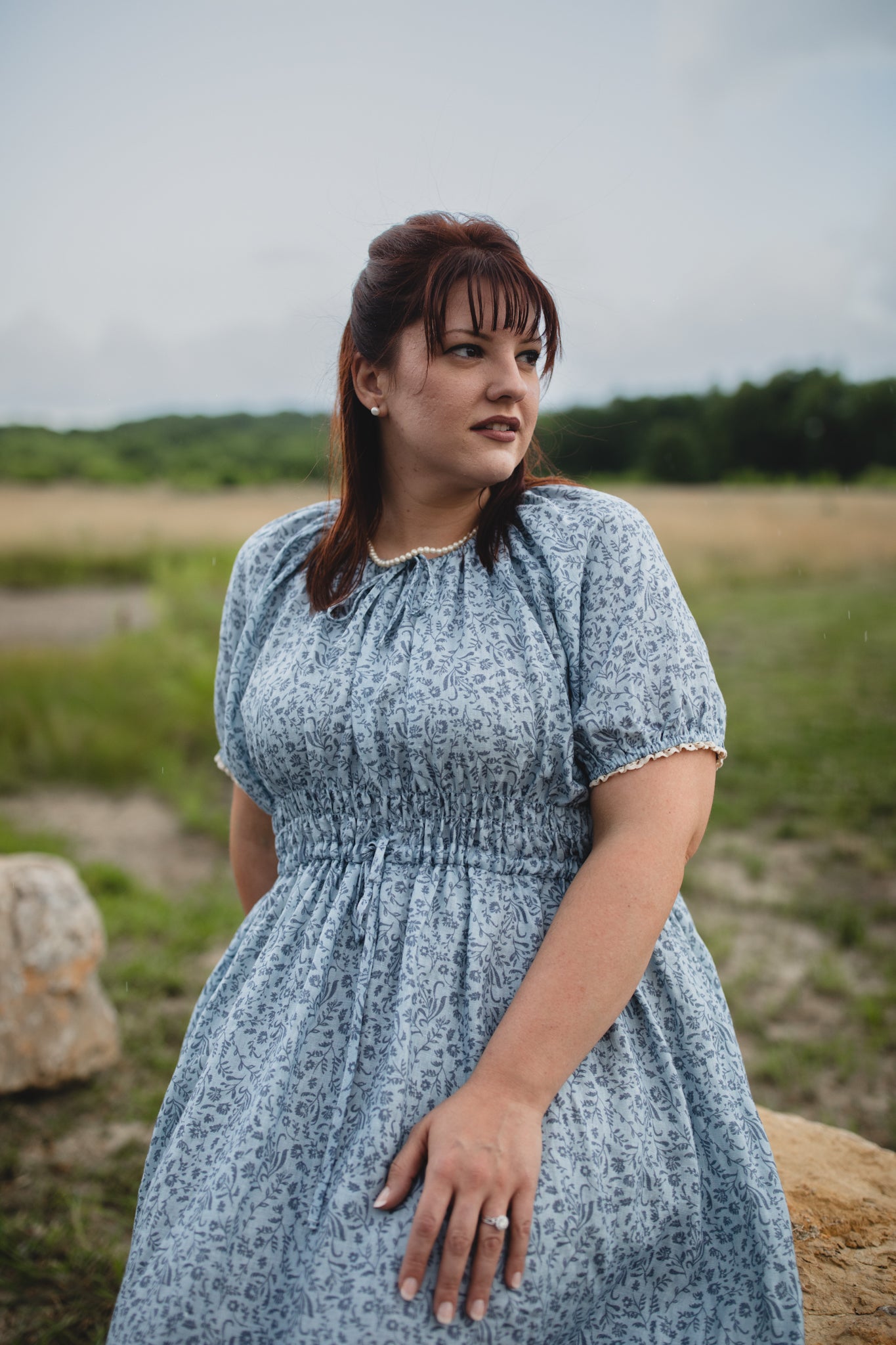 woman in a modest blue nursing dress