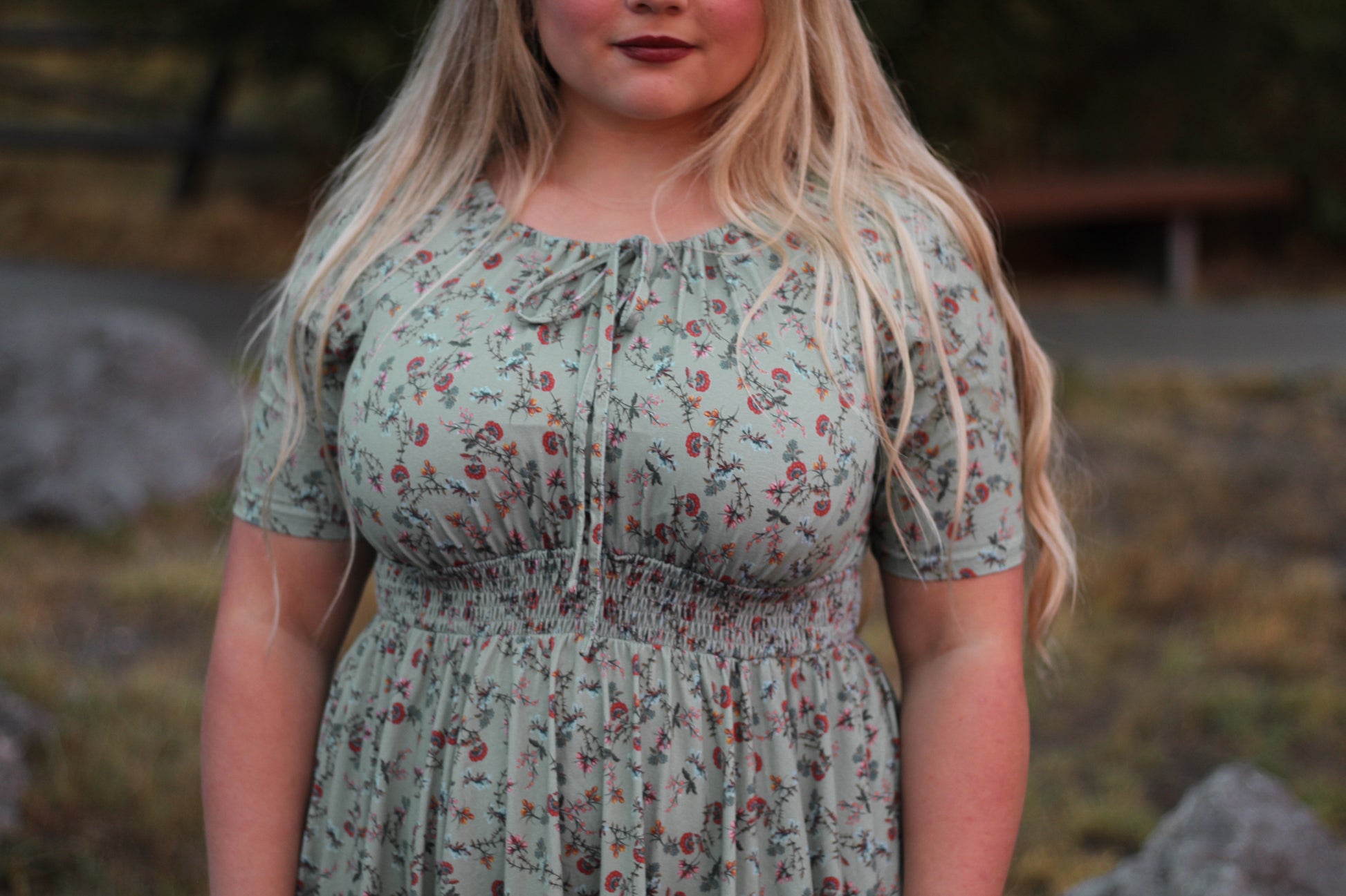 Woman in modest nursing floral dress outdoors