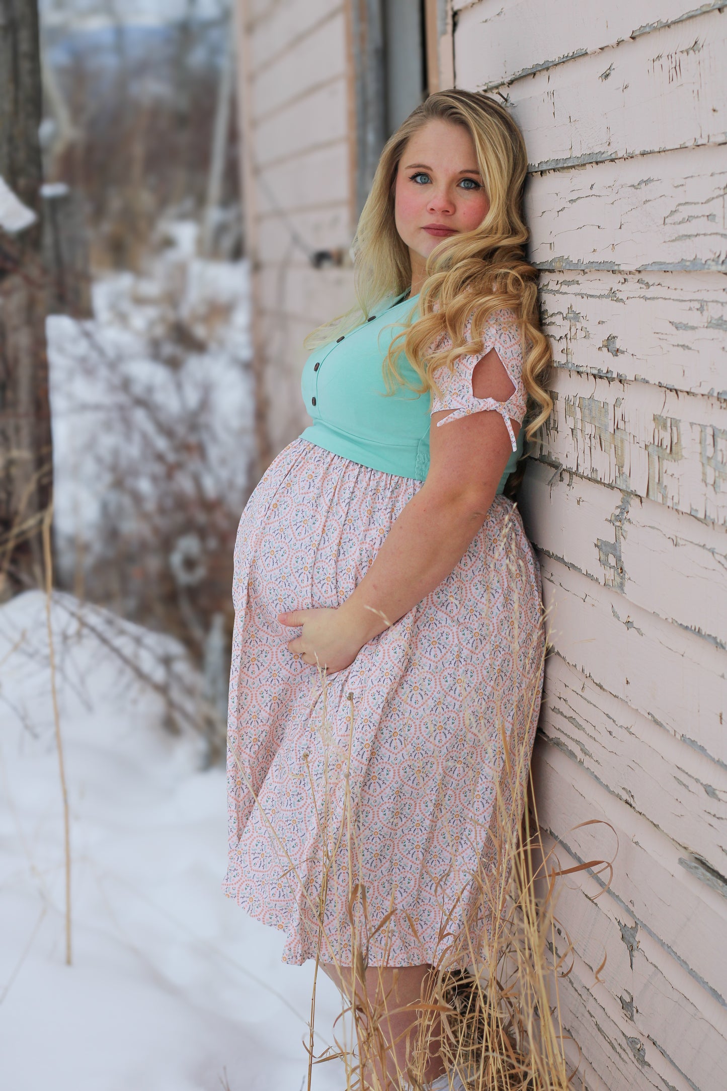 A woman wearing a vintage style modest nursing dress.
