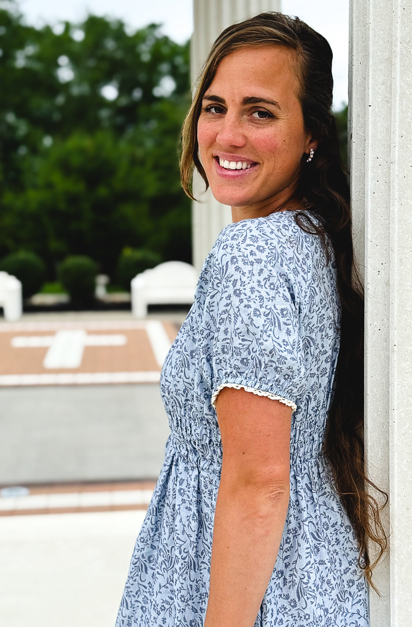 woman in a modest blue nursing dress