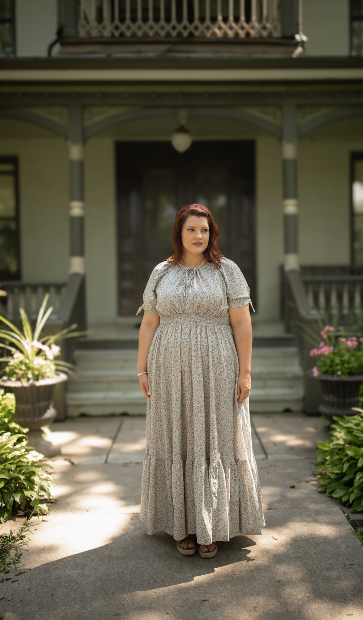 woman in patterned modest nursing dress