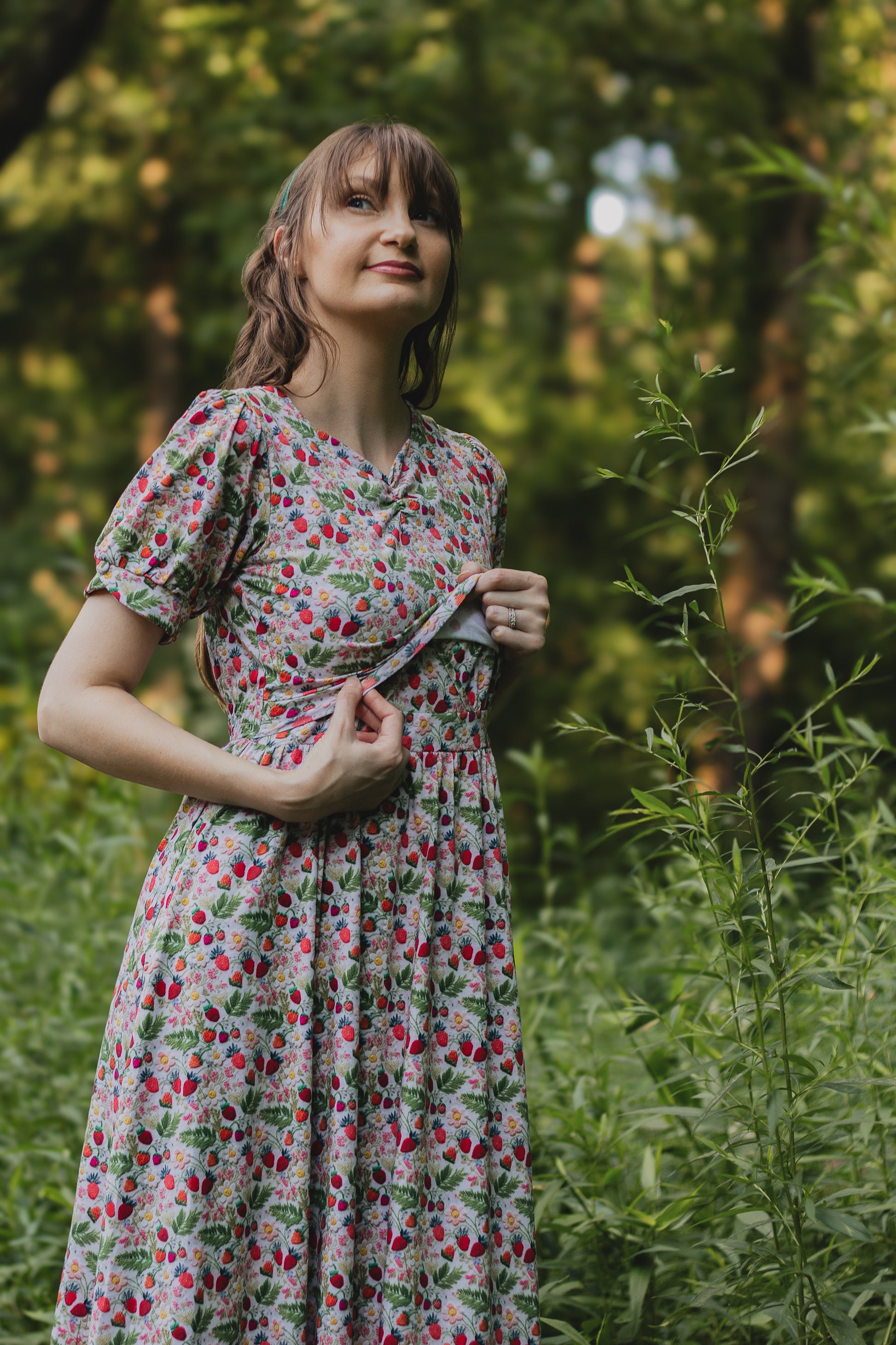 Woman in a floral modest nursing dress