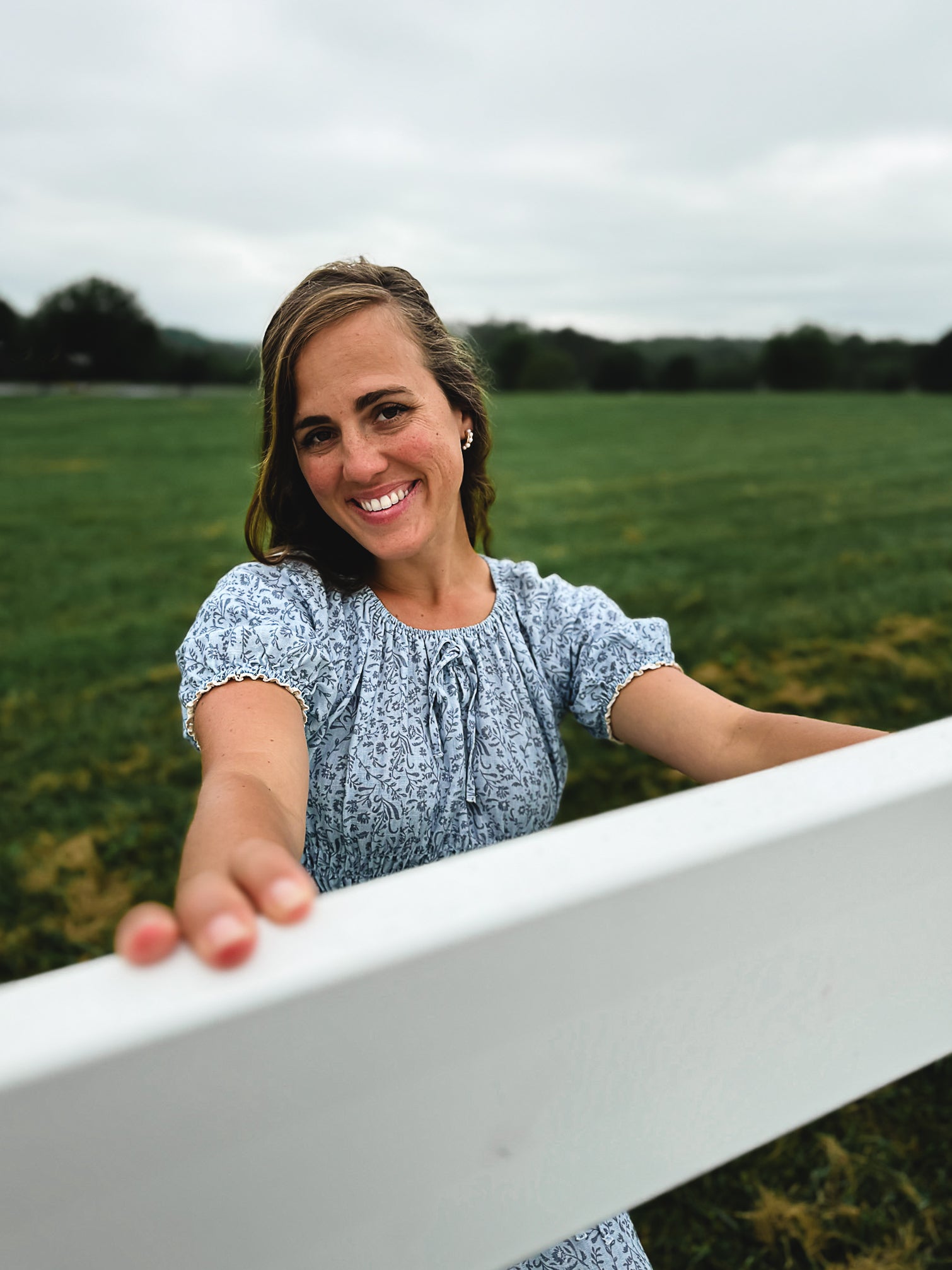 woman in a modest blue nursing dress