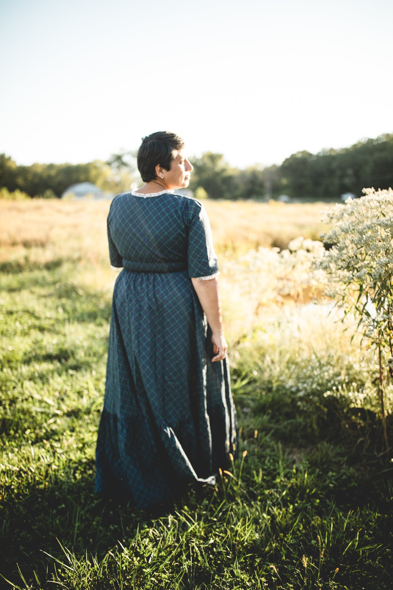 woman wearing a modest nursing blue patterned dress