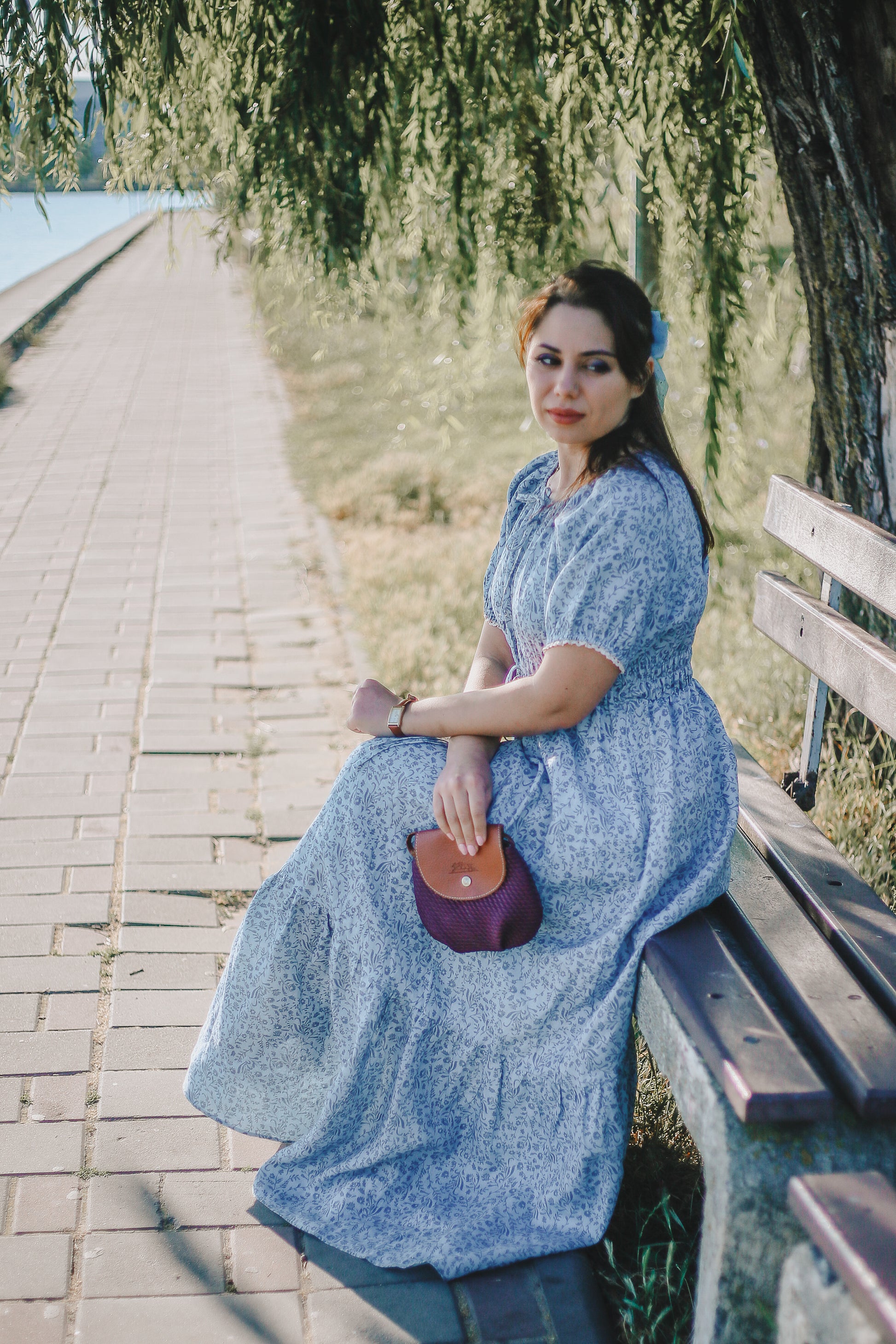 woman in a modest blue nursing dress
