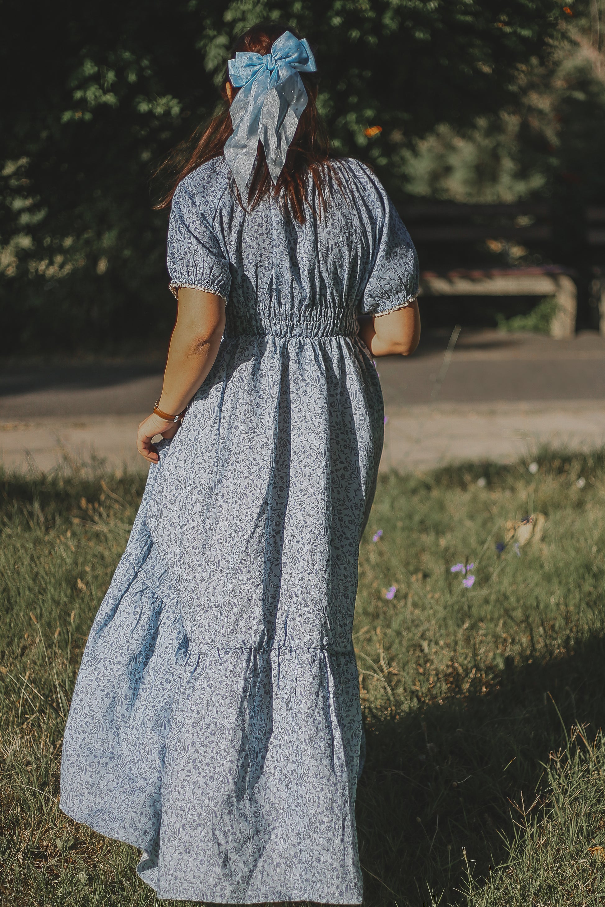 woman in a modest blue nursing dress