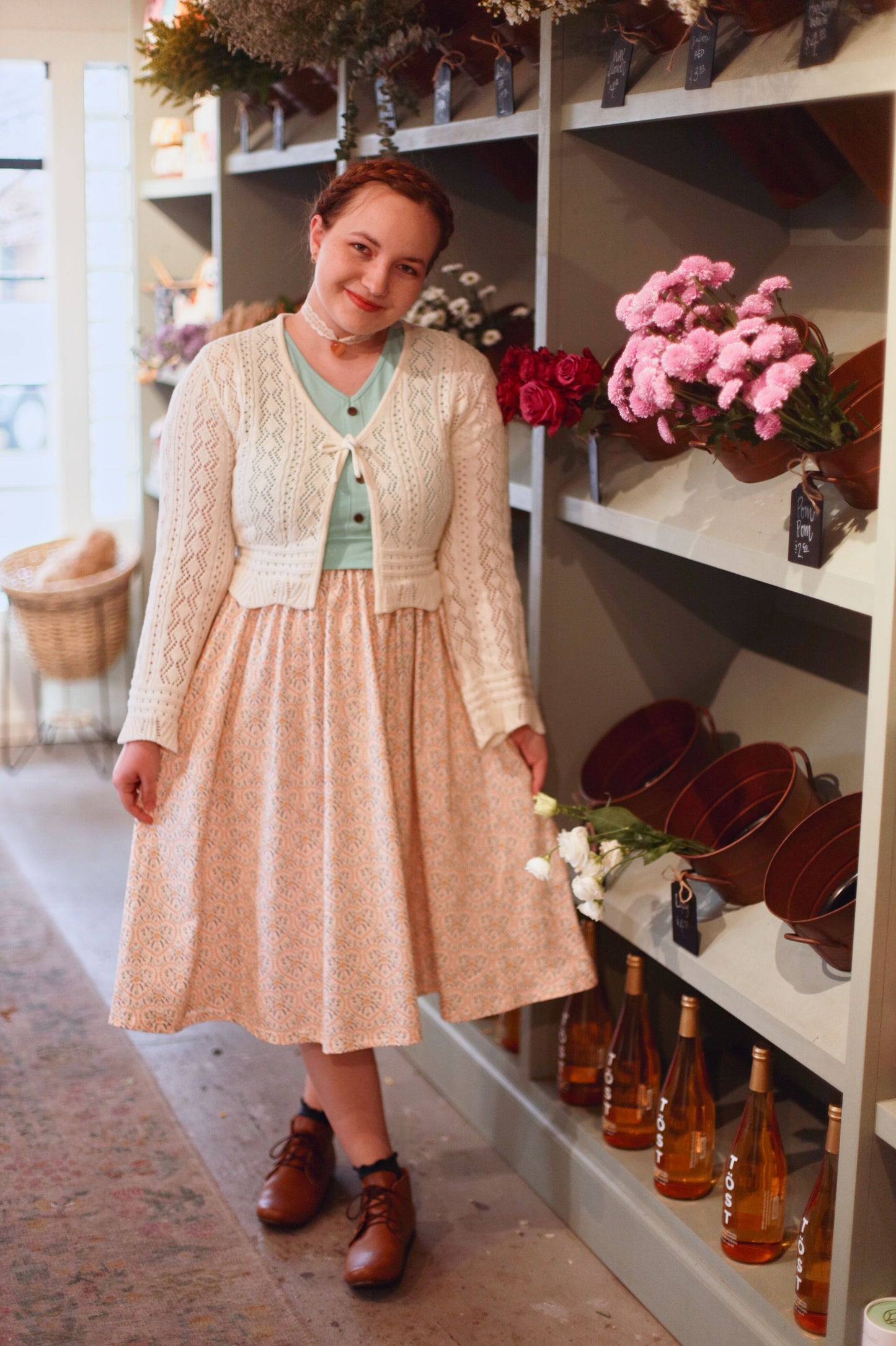 A woman wearing a vintage style modest nursing dress.