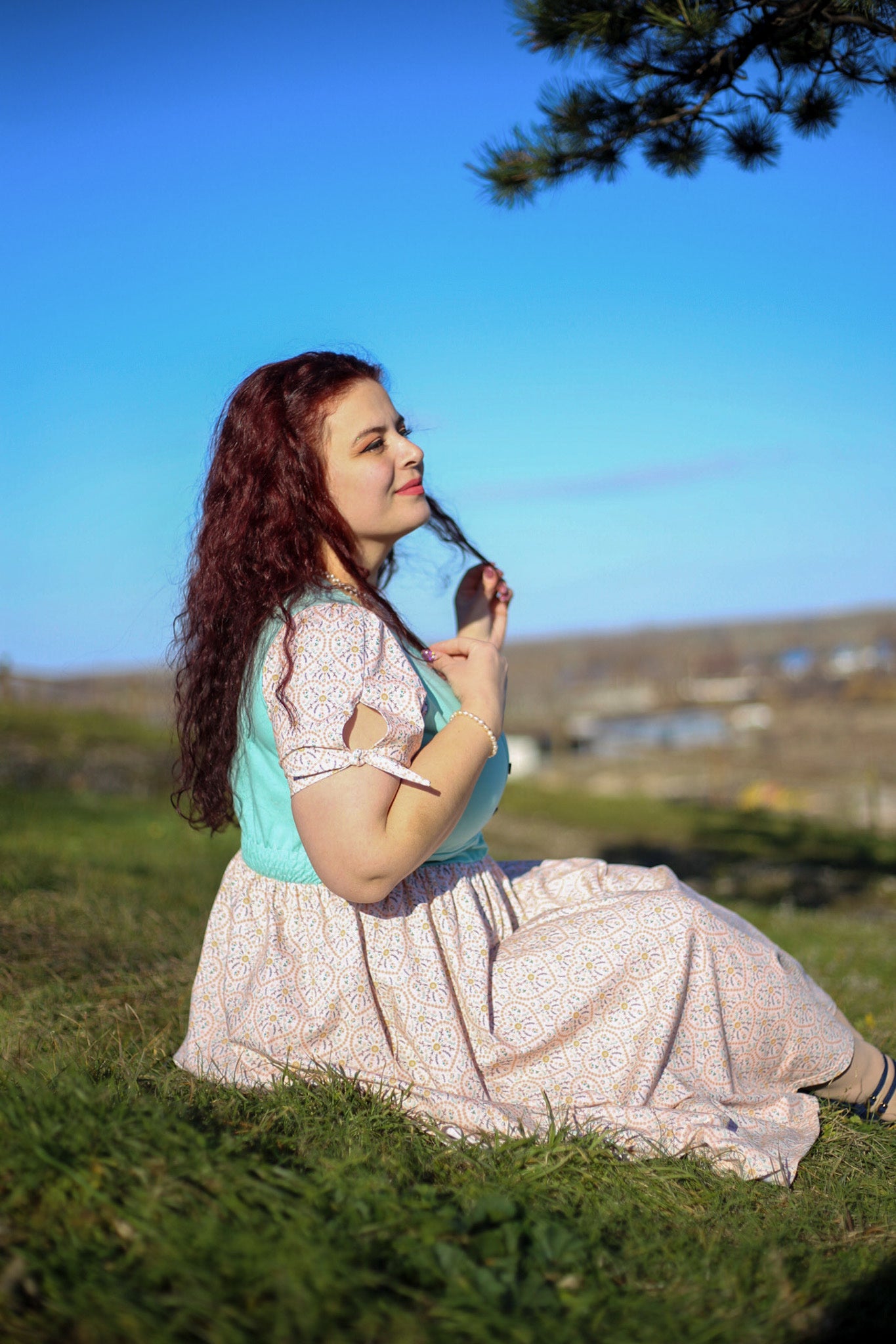A woman wearing a vintage style modest nursing dress.