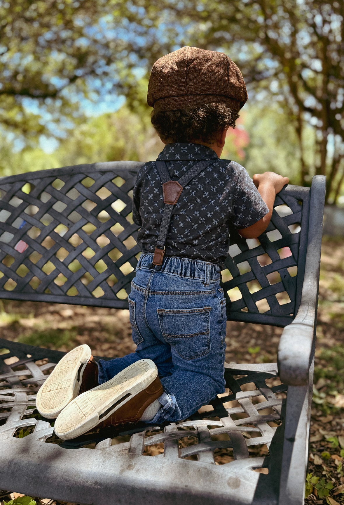 Young boy wearing a dark blue polo shirt