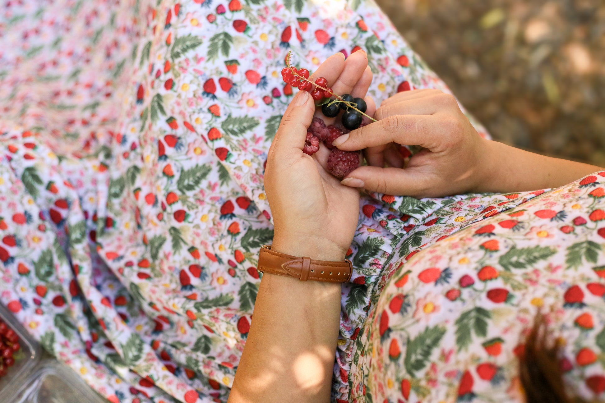 Woman in a floral modest nursing dress.