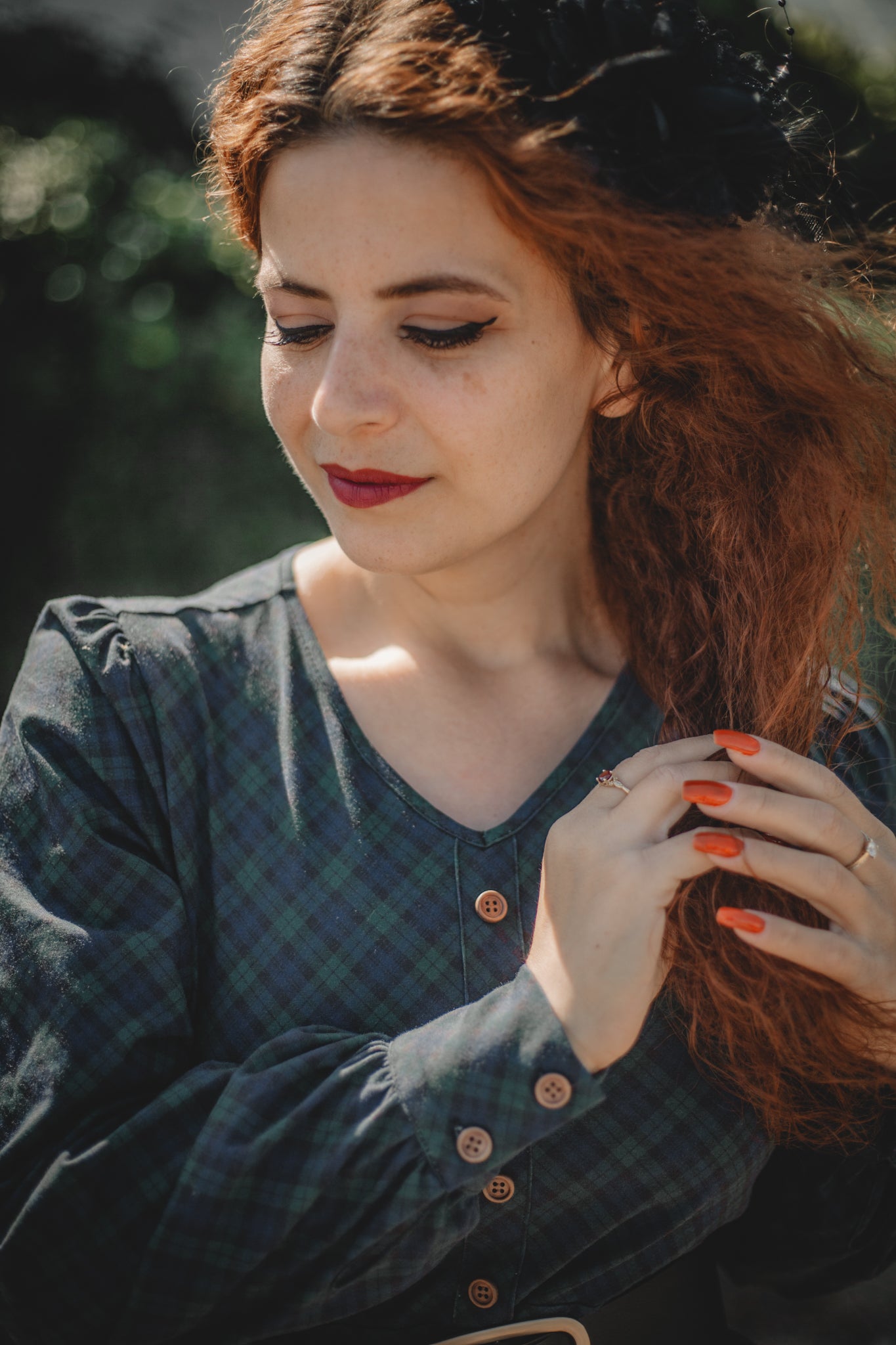 Woman in modest nursing dark dress outdoors