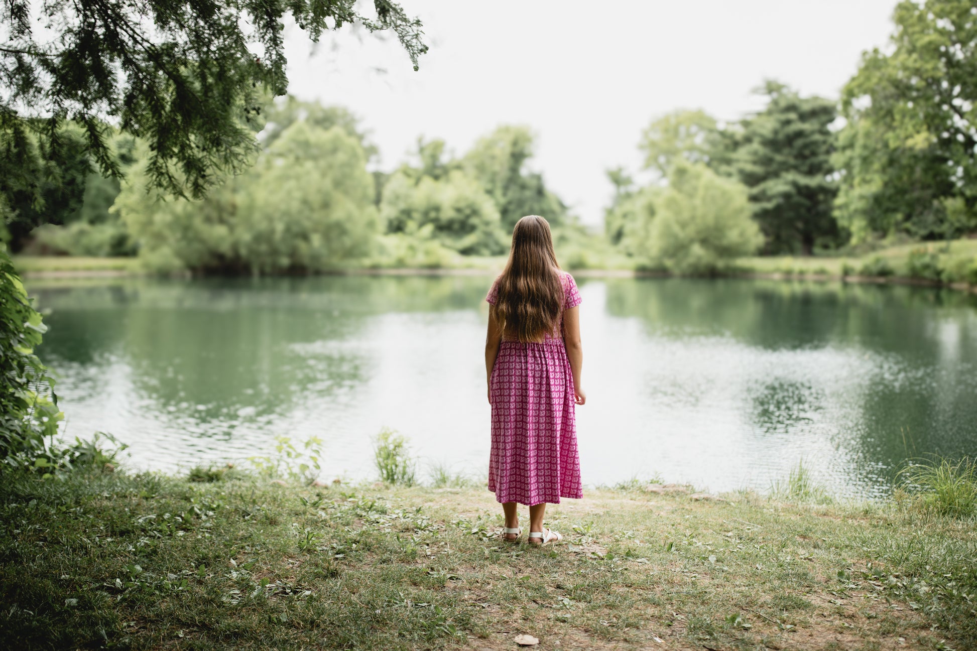 Young girl in a modest pink dress