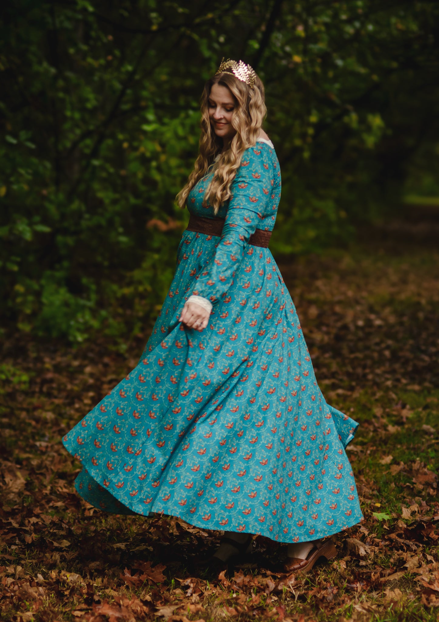 Woman in modest nursing teal floral dress in forest