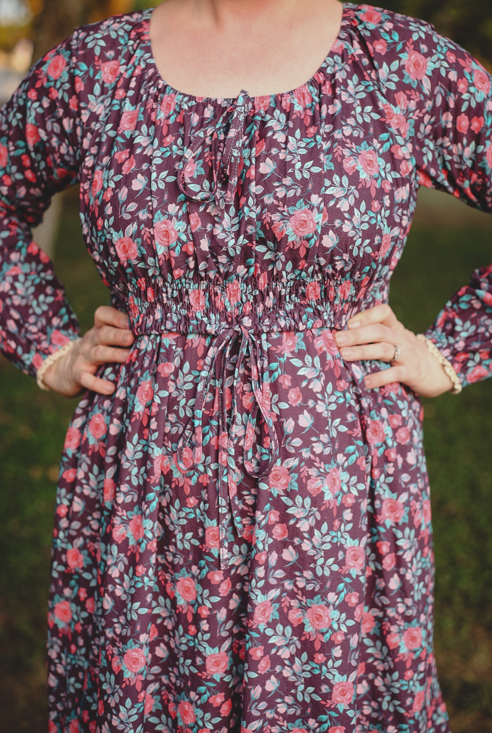 Woman in modest nursing floral dress outdoors