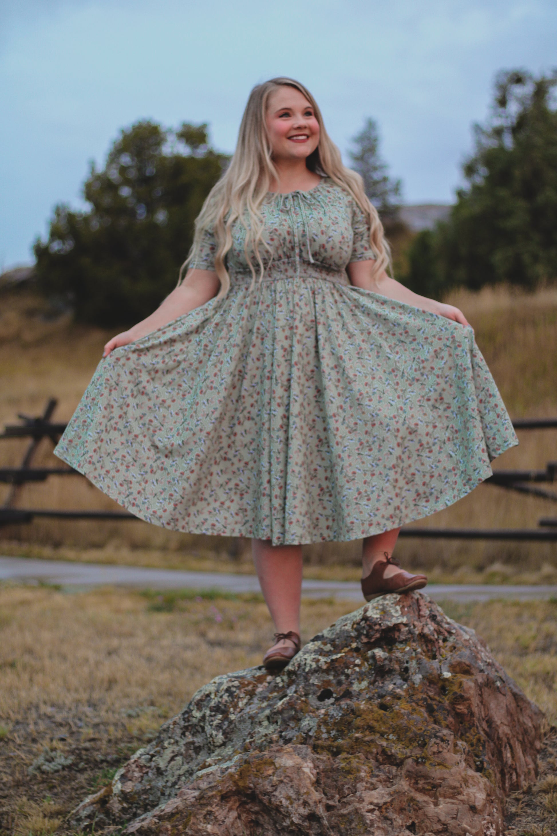 Woman in modest nursing floral dress outdoors