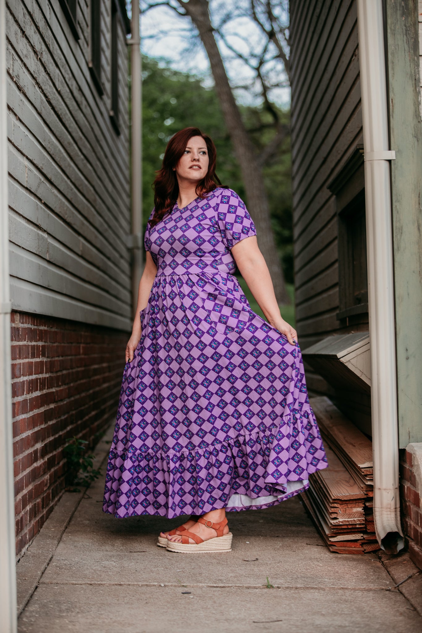 woman wearing patterned purple modest nursing dress