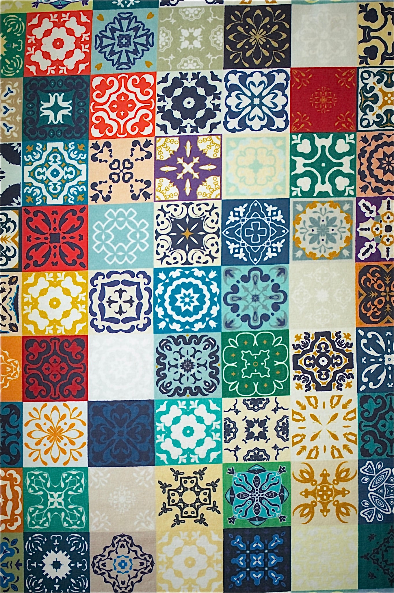 Multicolored patterned fabric with various geometric designs.